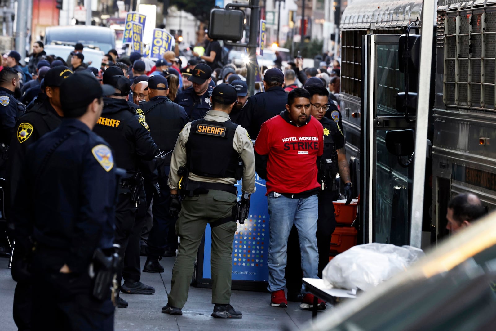 FILE - Protesters who refused to stop blocking Powell Street are arrested by San Francisco police officers and sheriff's deputies as hotel workers and members of Unite Here Local 2 march through downtown in San Francisco, on Oct. 30, 2024. (Carlos Avila Gonzalez/San Francisco Chronicle via AP, File)