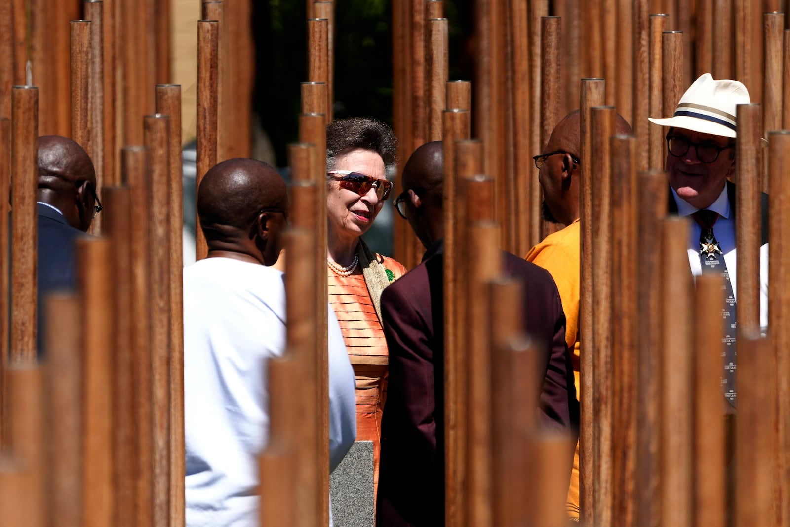 Britain's Princess Anne, the President of the Commonwealth War Graves Commission, centre, in conversation with official during the opening of a memorial dedicated to more than 1,700 Black South African servicemen who died in non-combatant roles in World War I and have no known grave, in Cape Town, South Africa, Wednesday, Jan. 22, 2025. (AP Photo/Nardus Engelbrecht)