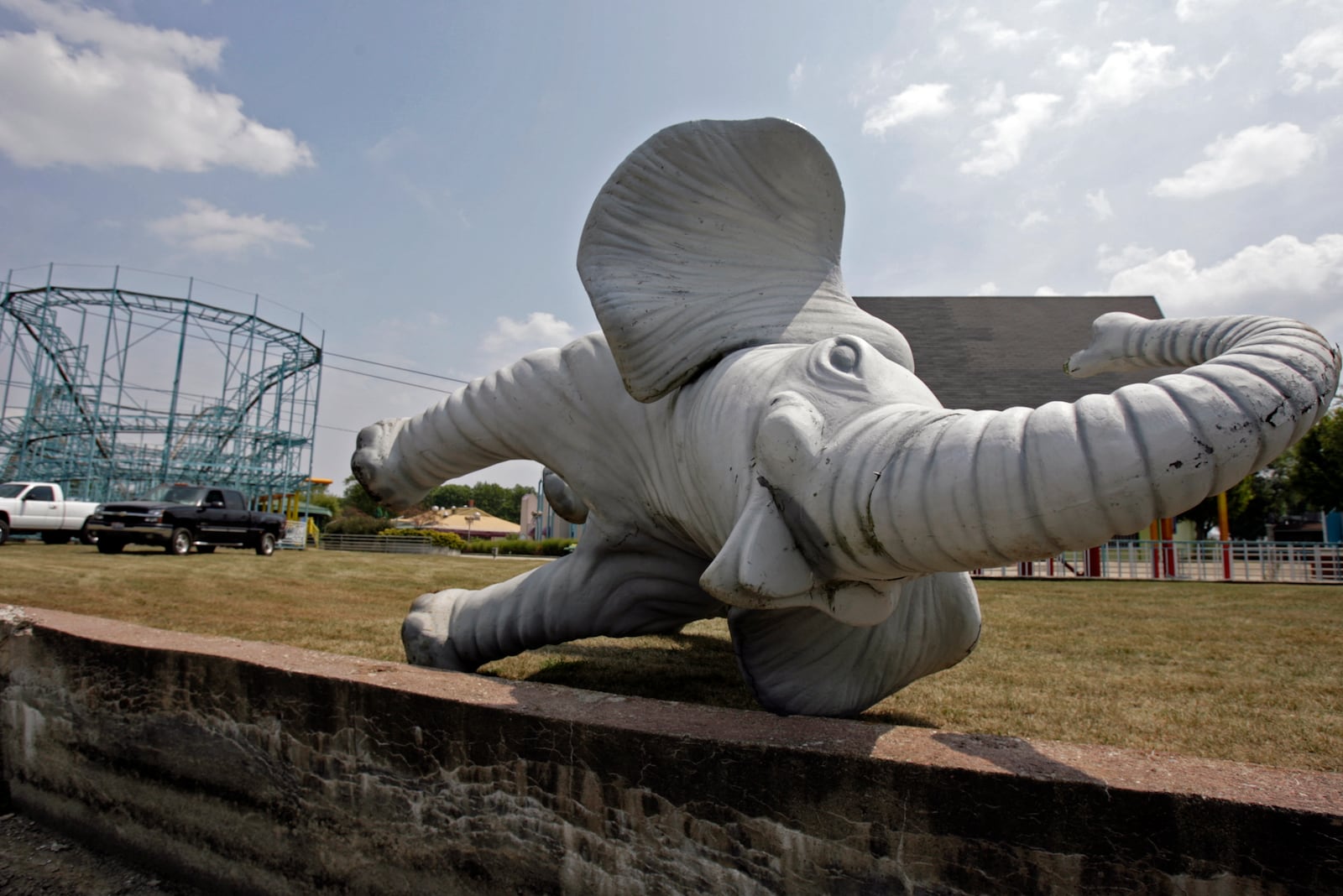 A fiberglass elephant lies on the side of a drained lake in 2006 after LeSourdsville Lake employees removed it from the closed amusement park.