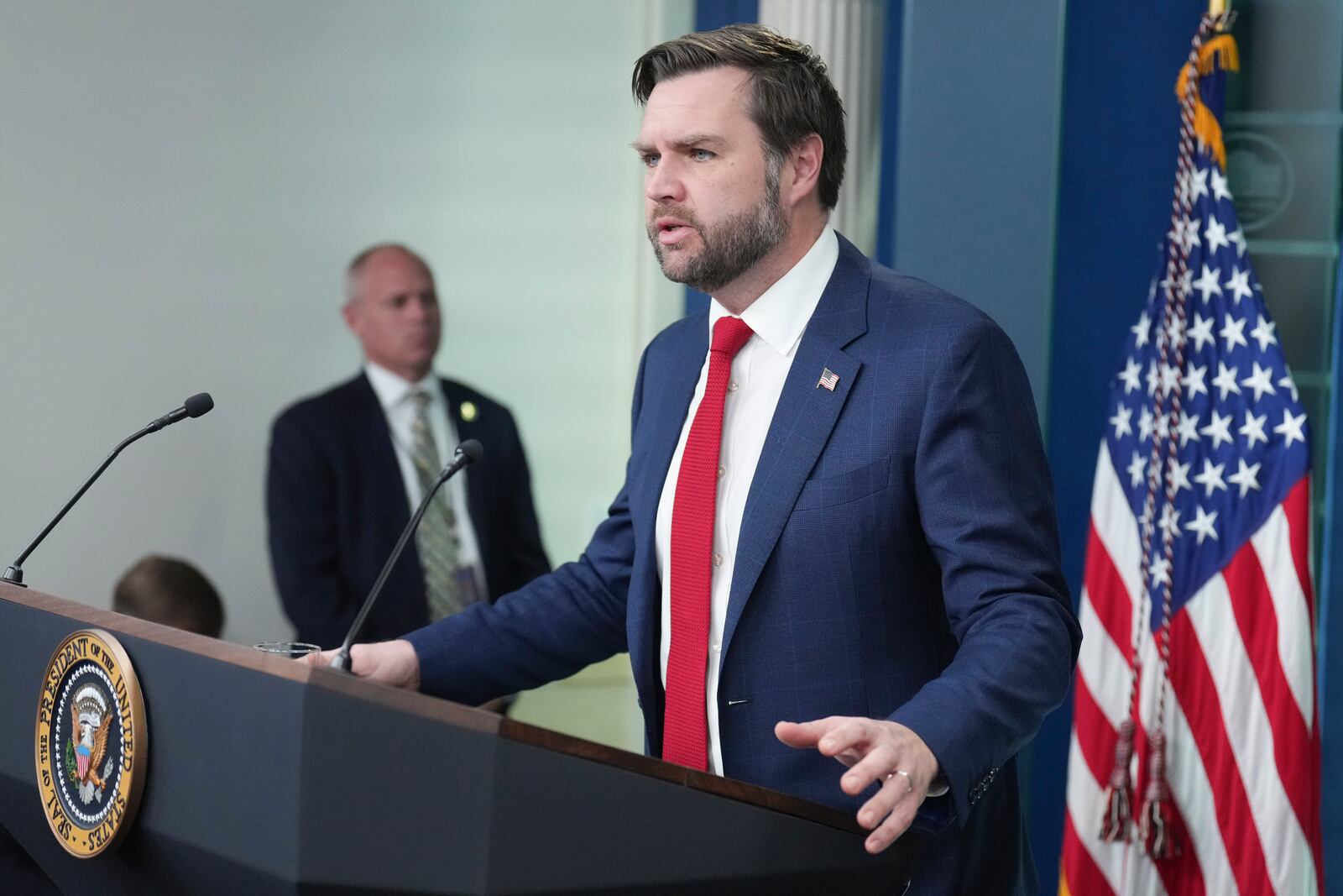 Vice President JD Vance speaks with reporters in the James Brady Press Briefing Room at the White House, Thursday, Jan. 30, 2025, in Washington. (AP Photo/Jacquelyn Martin)