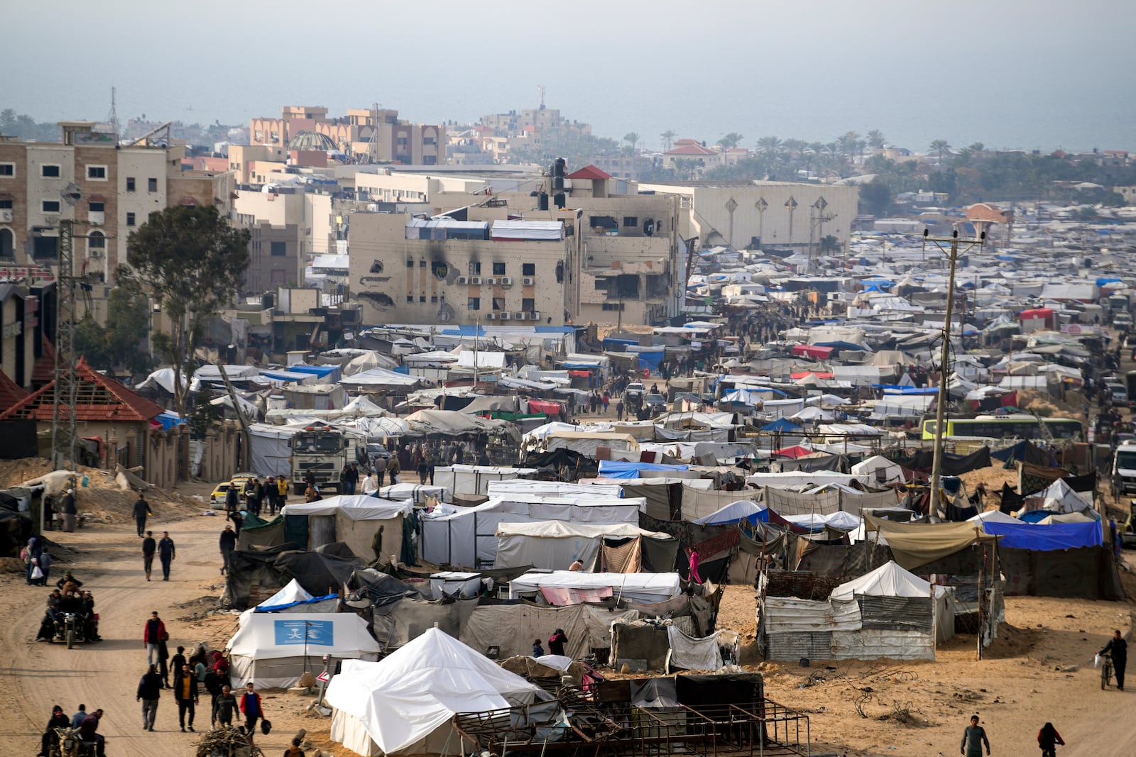 FILE - A tent camp for displaced Palestinians is set up amid destroyed buildings in the Khan Younis refugee camp, southern Gaza Strip, on Saturday, Jan. 4, 2025. (AP Photo/Abdel Kareem Hana, File)