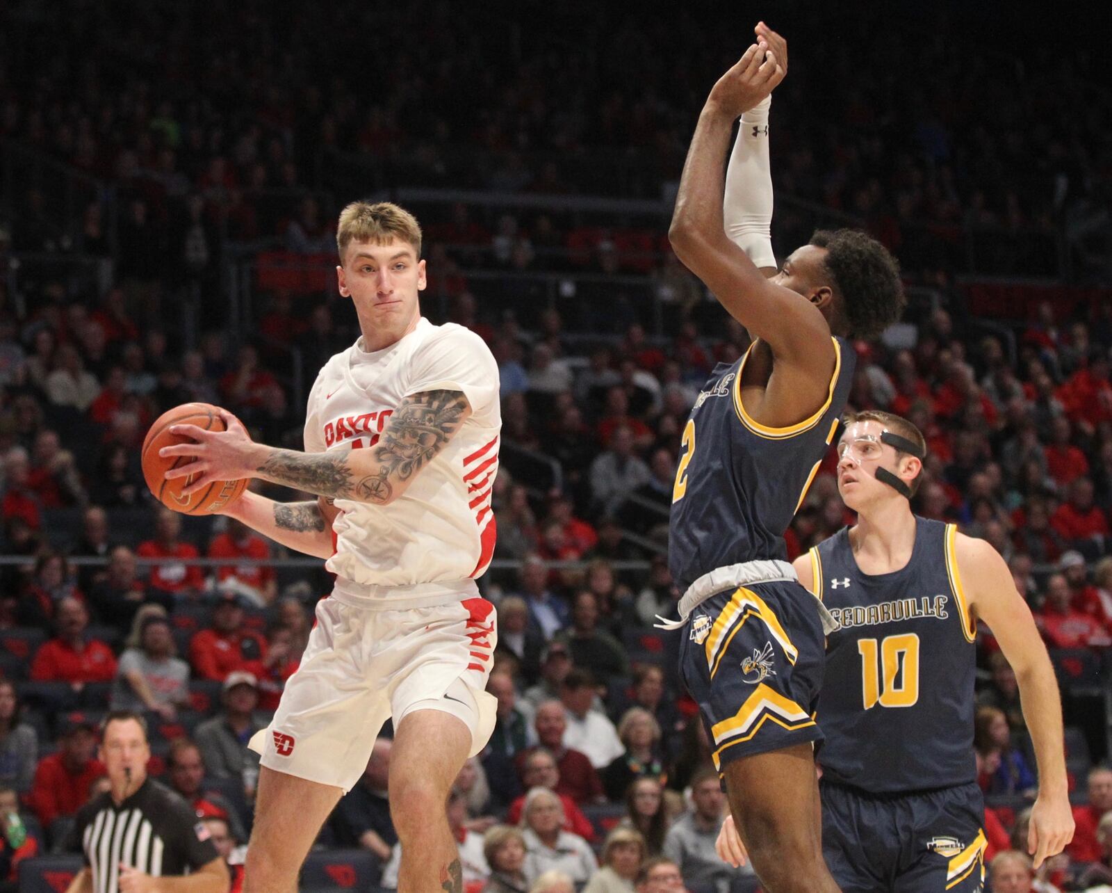 Dayton’s Chase Johnson makes a pass against Cedarville in an exhibition game on Saturday, Nov. 2, 2019, at UD Arena.