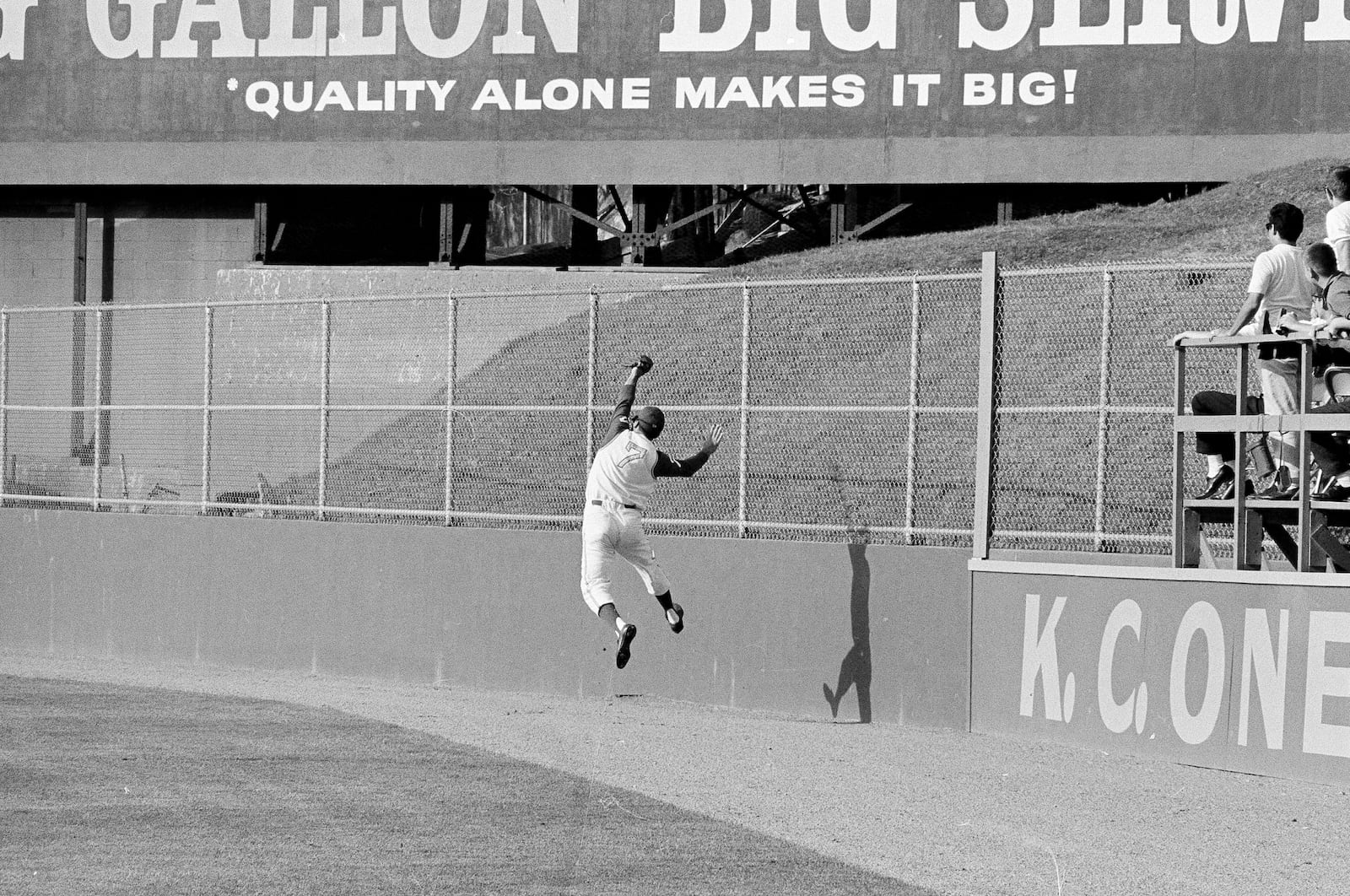 FILE - Kansas City's right fielder Rocky Colavito makes a running, leaping backhand catch of a fly ball by Minnesota's Bernie Allen in the eighth inning at Kansas City, Mo., May 3, 1964. (AP Photo/William P. Straeter, File)