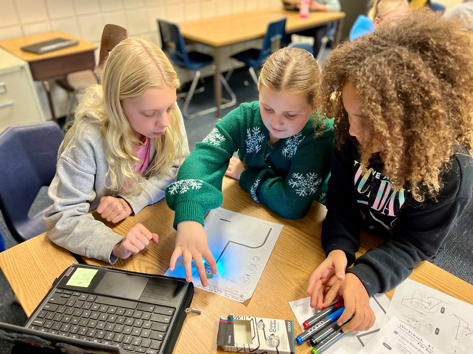 During their weekly Tech Time class, fourth graders at Centerville's Driscoll Elementary School practice coding by creating a path for an Ozobot mini robot to follow.