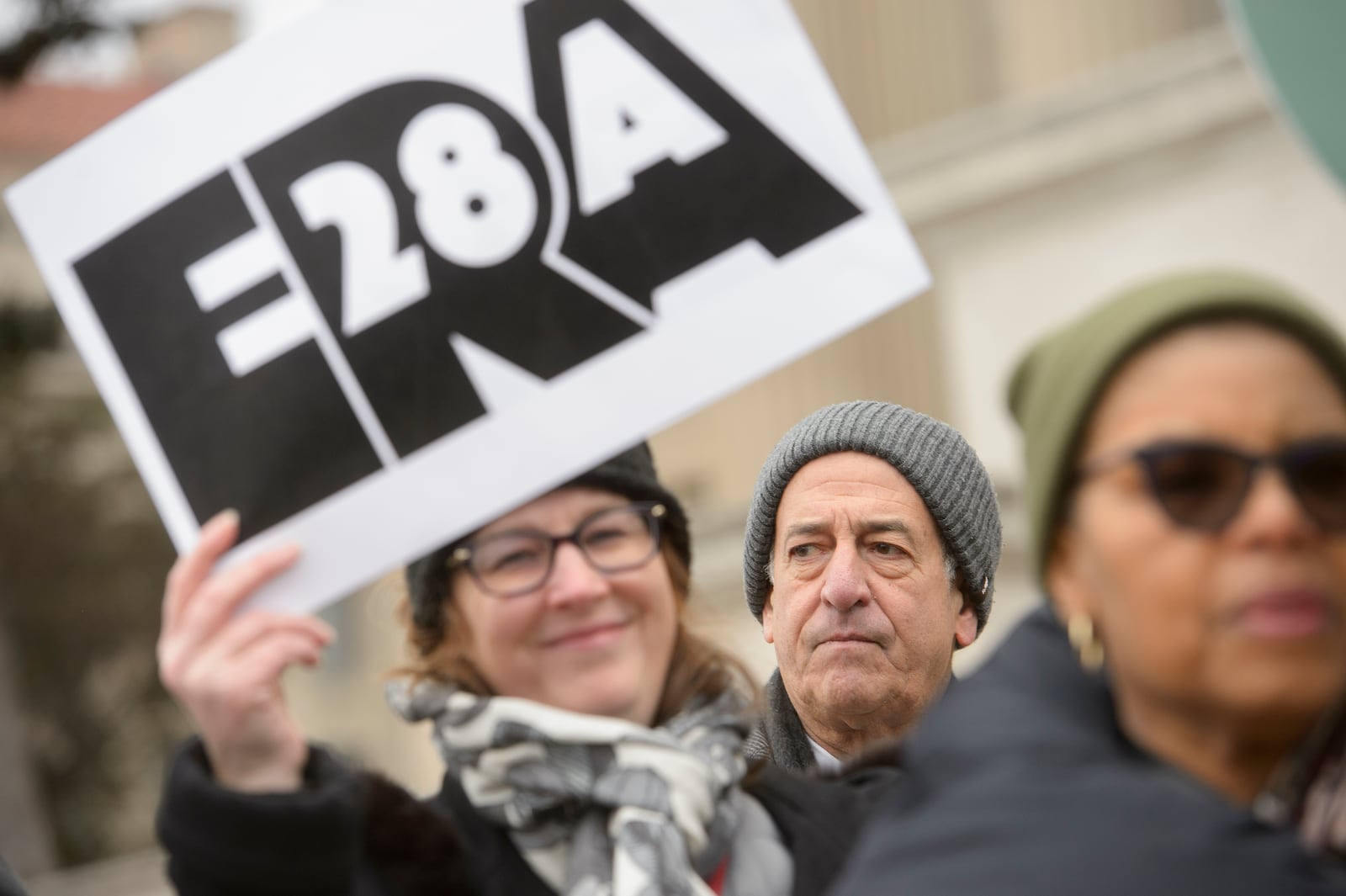 American Constitution Society President and former Senator Russell Feingold, center, joins others for a rally in front of the National Archives to highlight President Joe Biden's decision to declare the Equal Rights Amendment (ERA) as the 28th Amendment to the United States Constitution, Friday, Jan. 17, 2025, in Washington. (AP Photo/Rod Lamkey, Jr.)