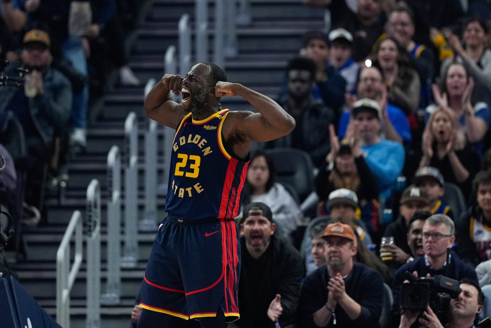 Golden State Warriors forward Draymond Green reacts after scoring against the Miami Heat during the first half of an NBA basketball game Tuesday, Jan. 7, 2025, in San Francisco. (AP Photo/Godofredo A. Vásquez)