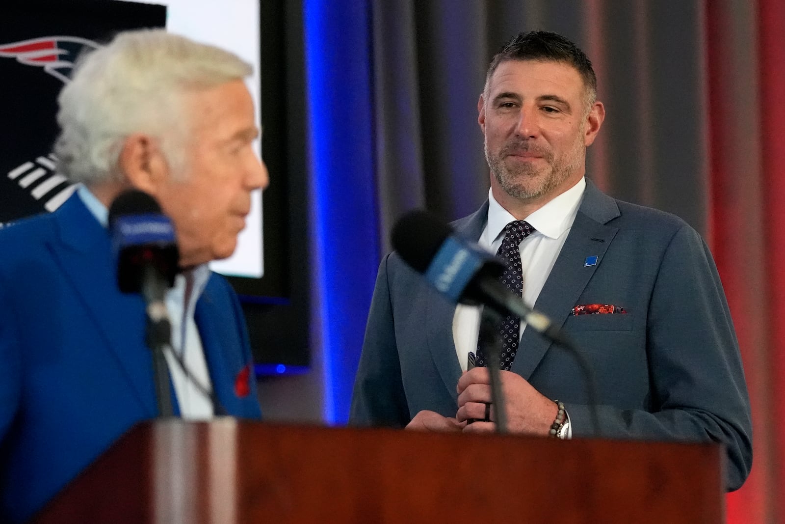 New England Patriots head coach Mike Vrabel listens to team owner Robert Kraft while being introduced during an availability, Monday, Jan. 13, 2025, in Foxborough, Mass. (AP Photo/Charles Krupa)