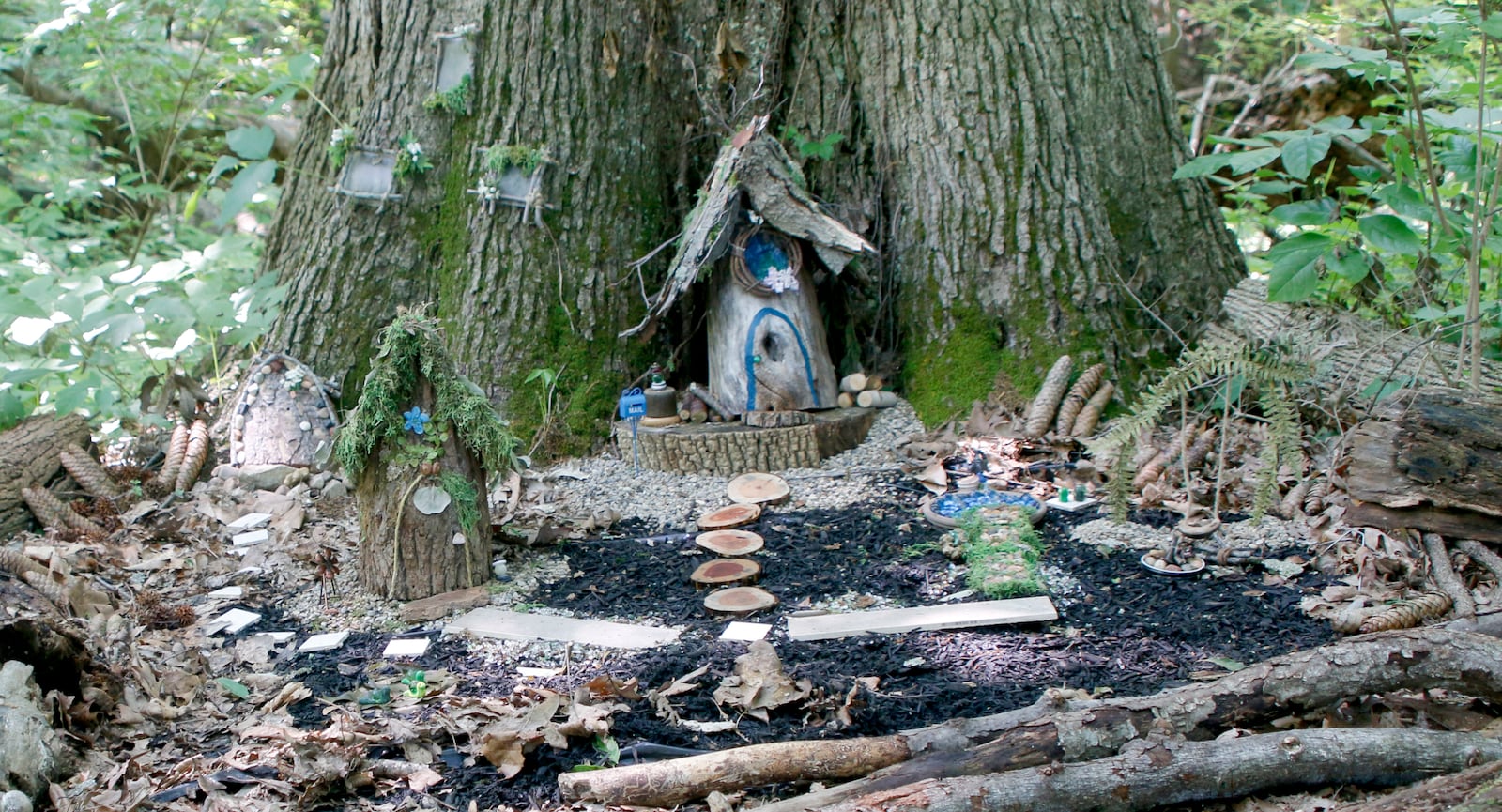 Christine Evans and Debbie Snyder designed this home using wood for the Aullwood Faerie House Exhibit, Earth Elements. DAVE HILL/COURTSEY PHOTO