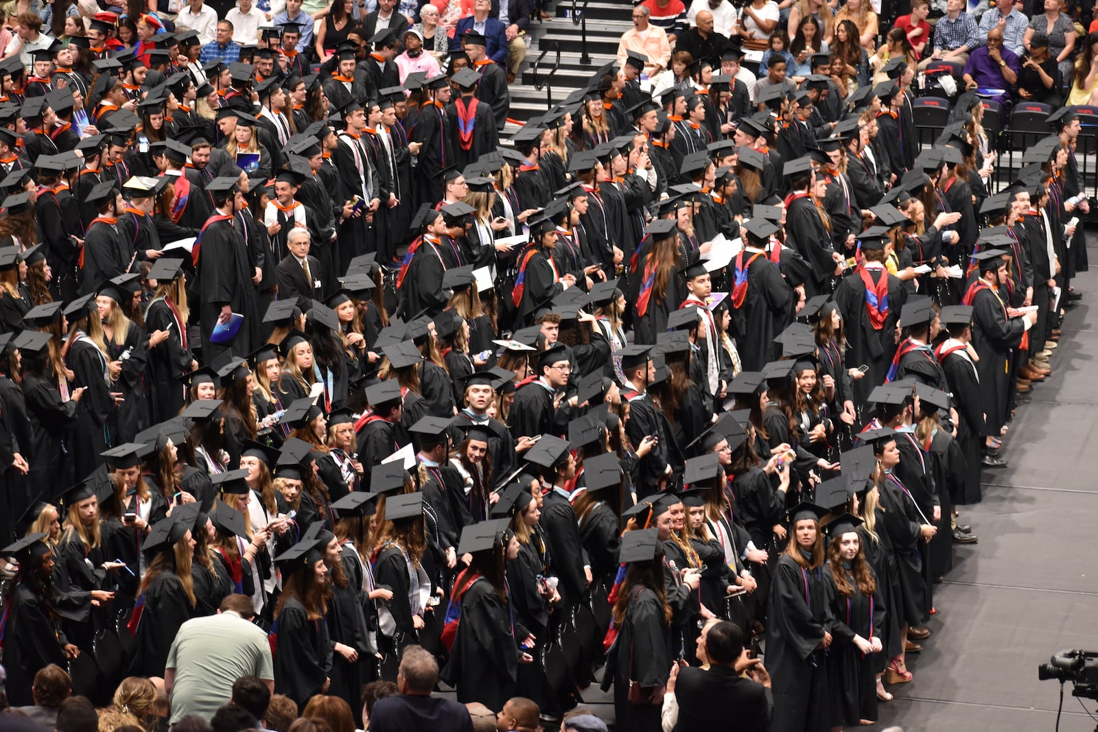 University of Dayton 2024 graduates wait for the undergraduate commencement to start on Sunday, May 5, 2024, at UD Arena. SAM WILDOW\STAFF