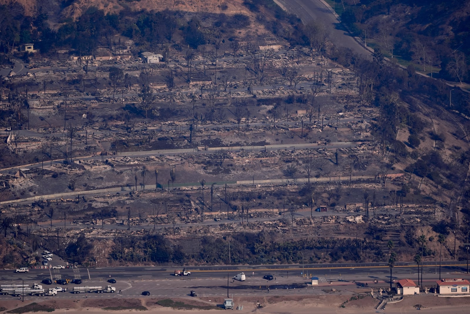 The devastation from the Palisades Fire is seen from the air in the Pacific Palisades neighborhood of Los Angeles, Thursday, Jan. 9, 2025. (AP Photo/Mark J. Terrill)