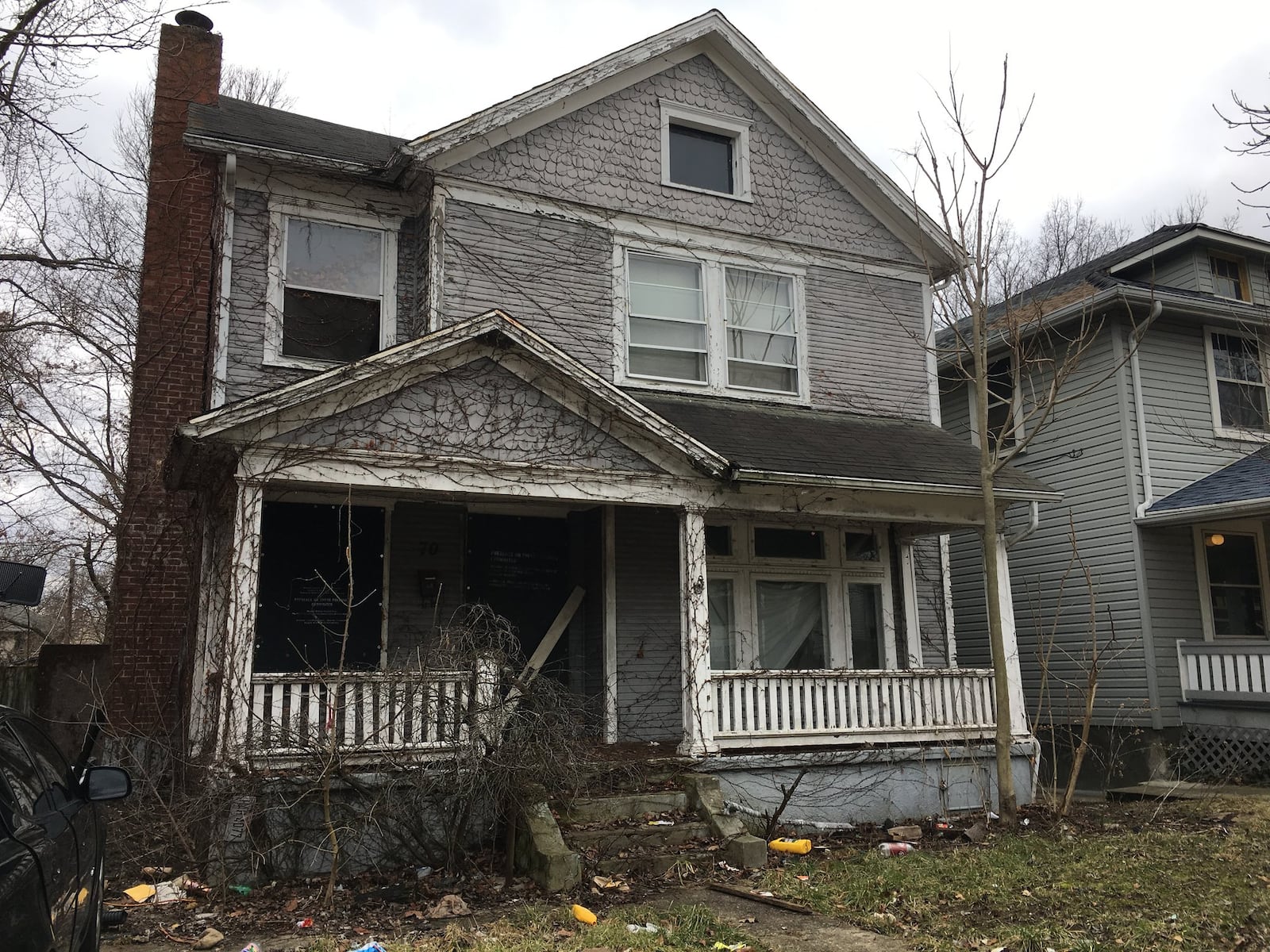 This dilapidated house at 70 W. Hudson Ave. is among 33 Hudson Avenue houses on a list of vacant, tax delinquent and presumed abandoned on a list compiled by Montgomery County Auditor. It is down the street from the house at 22 W. Hudson Street where the body of homicide victim Krystal Garcia, 30, of Dayton was found on Sept. 25. LYNN HULSEY/Staff