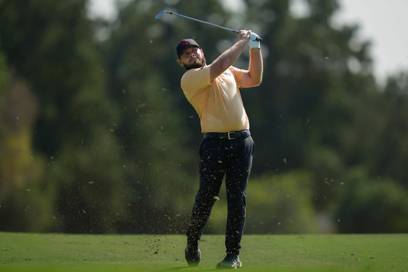 Tyrell Hatton of England plays his second shot on the 2nd hole during the second round of World Tour Golf Championship in Dubai, United Arab Emirates, Friday, Nov. 15, 2024. (AP Photo/Altaf Qadri)