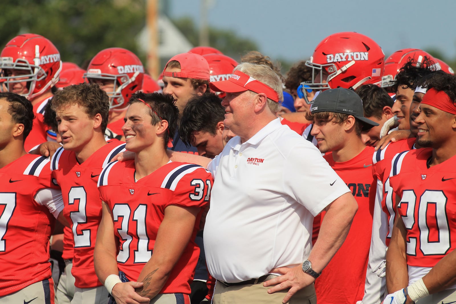 Dayton players and coach Rick Chamberlin smile after a victory against Eastern Illinois on Saturday, Sept. 11, 2021, at Welcome Stadium. David Jablonski/Staff