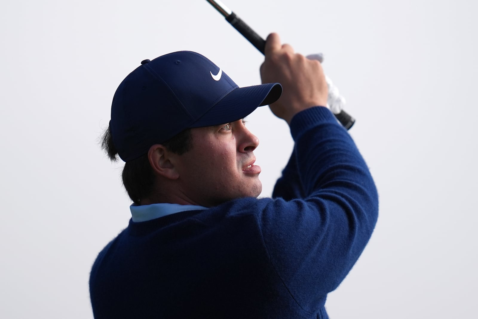 Davis Thompson hits a shot on the 16th hole of the South Course at Torrey Pines during the second round of the Genesis Invitational golf tournament Friday, Feb. 14, 2025, in San Diego. (AP Photo/Gregory Bull)