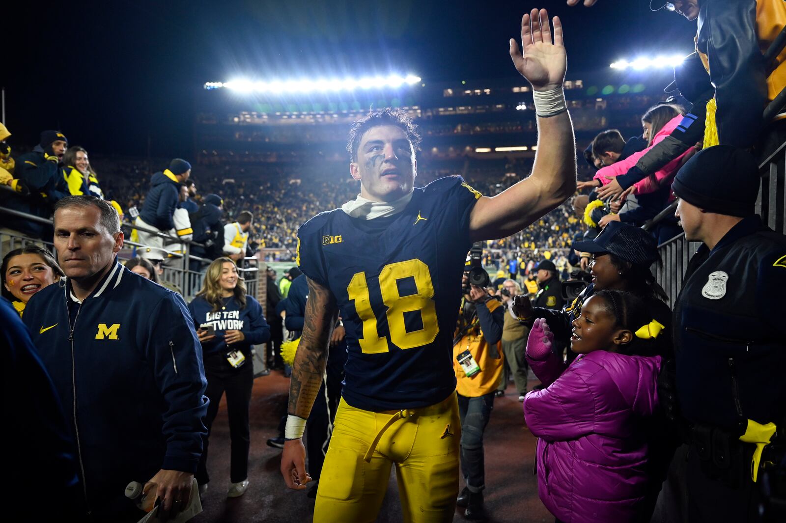 Michigan tight end Colston Loveland greets fans following an NCAA college football game against Michigan State, Saturday, Oct. 26, 2024, in Ann Arbor, Mich. (AP Photo/Jose Juarez)