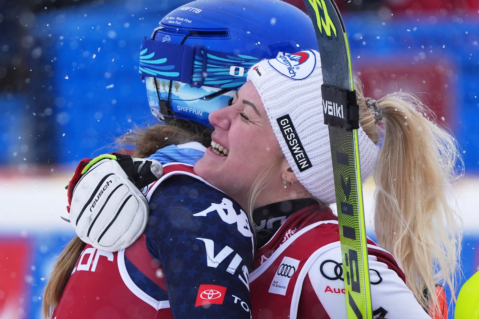 United States' Mikaela Shiffrin, left, third placed, embraces Austria's Katharina Truppe, the winner, after completing an alpine ski, women's World Cup slalom in Are, Sweden, Sunday, March 9, 2025. (AP Photo/Giovanni Auletta)