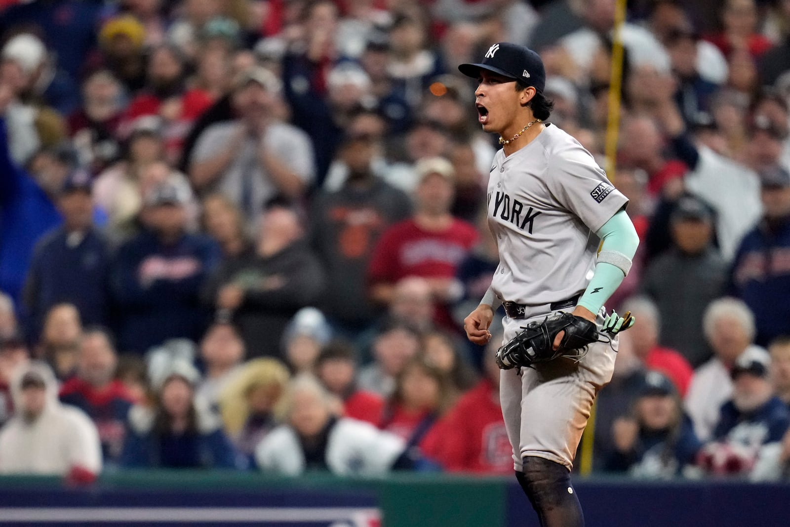 New York Yankees first baseman Oswaldo Cabrera reacts after a double play during the seventh inning in Game 5 of the baseball AL Championship Series against the Cleveland Guardians Saturday, Oct. 19, 2024, in Cleveland. (AP Photo/Sue Ogrocki)