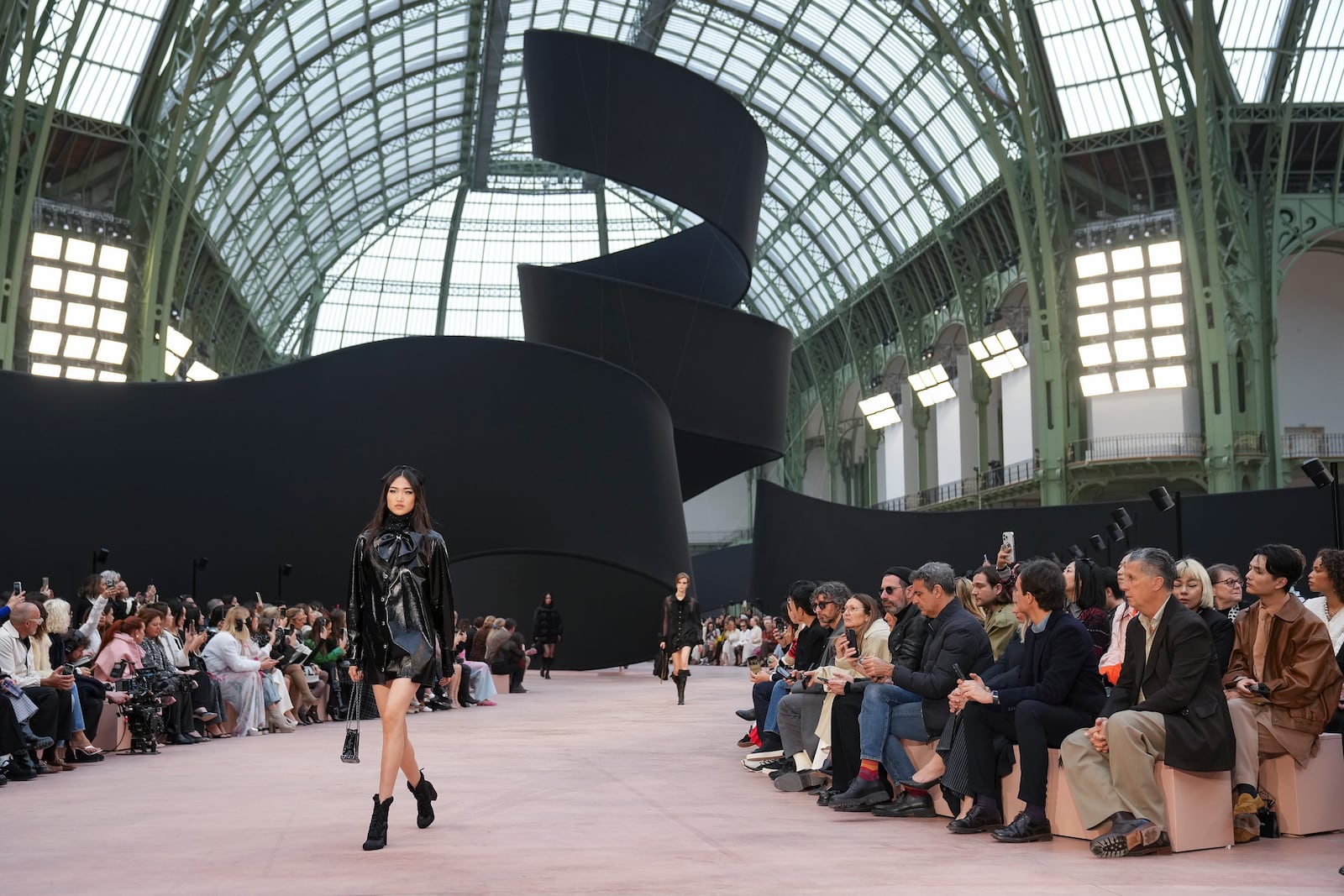 A model wears a creation as part of the Chanel Fall/Winter 2025-2026 Womenswear collection presented Tuesday, March 11, 2025. in Paris. (Photo by Scott A Garfitt/Invision/AP)