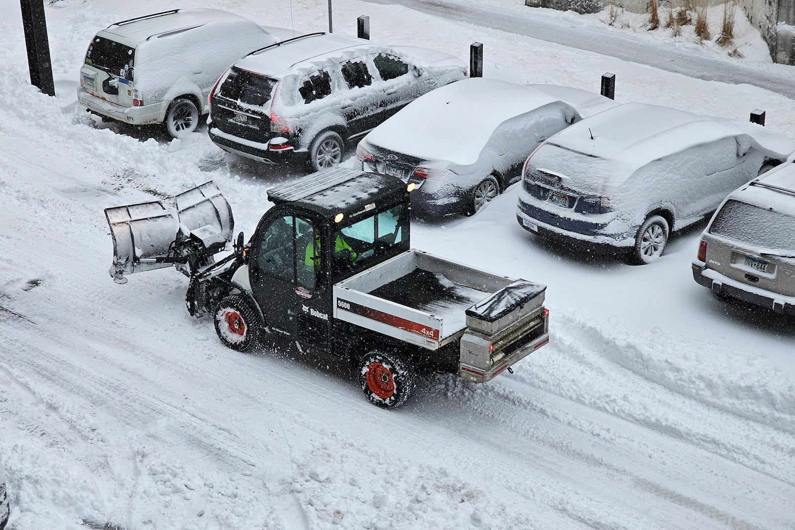 A snowplow is on the move in Minneapolis on Wednesday, March 5, 2025, amid the heaviest snowfall of the season in the city. (AP Photo/Steve Karnowski)