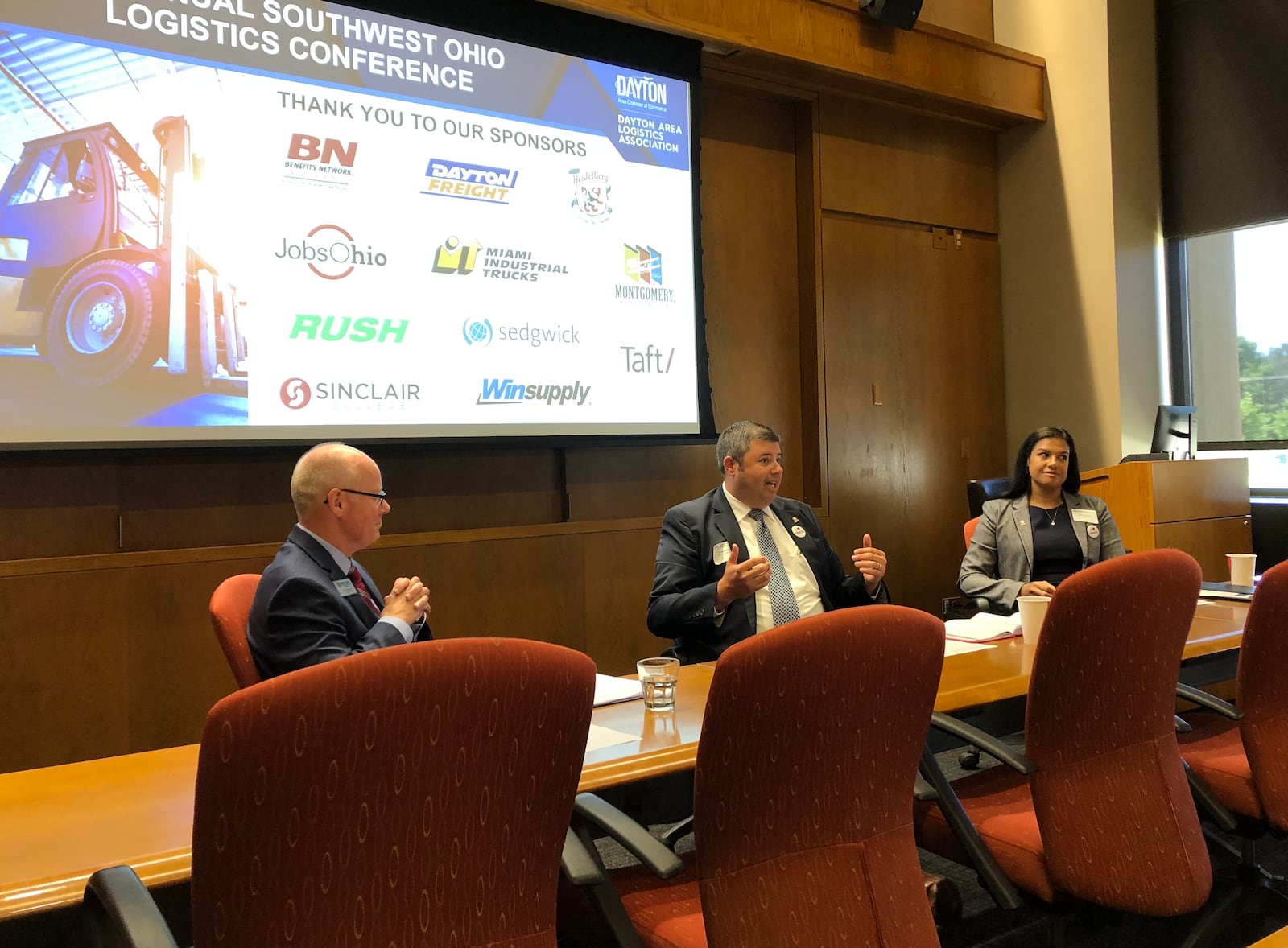 Sinclair Community College officials discuss workforce development during the 6th Annual Southwest Ohio Logistics Conference on June 22, 2021 at SinclairFrom left are Greg Wasmund, director of workforce development and strategic initiatives, Chad Bridgman, director of work-based learning and Carlina Figueroa, assistant director of the office of work-based learning