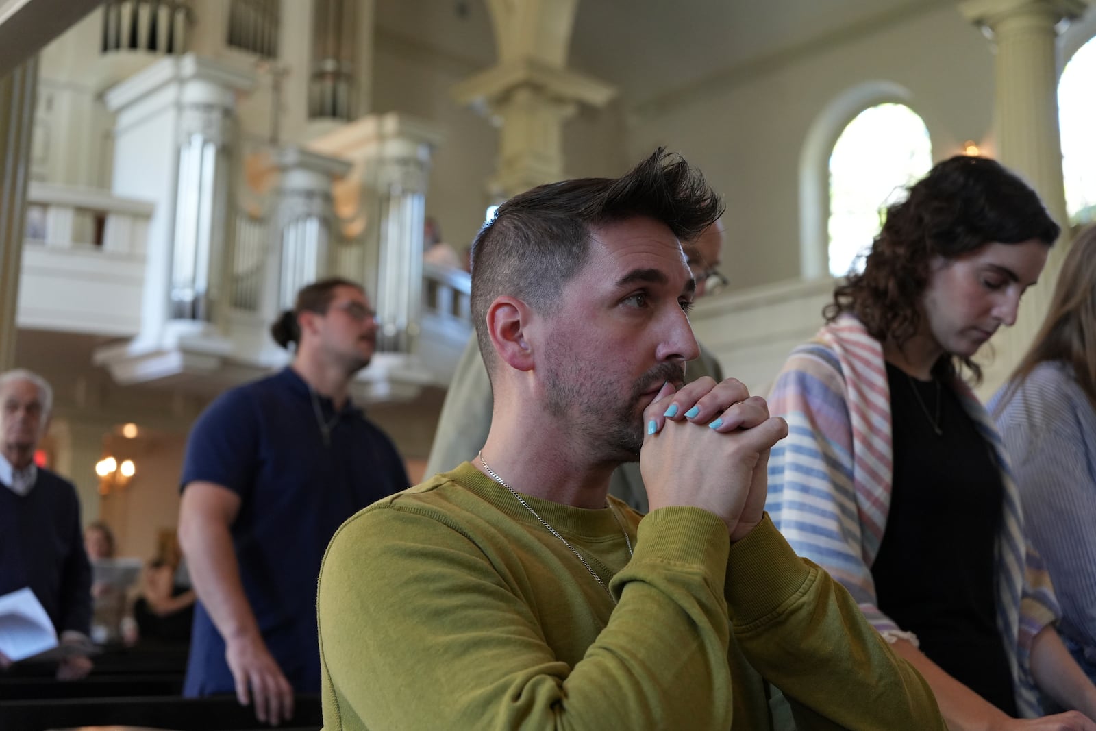 Congregant Andy Halstead prays during a service at Philadelphia’s Christ Church on Sunday, Oct. 6, 2024. (AP Photo/Luis Andres Henao)