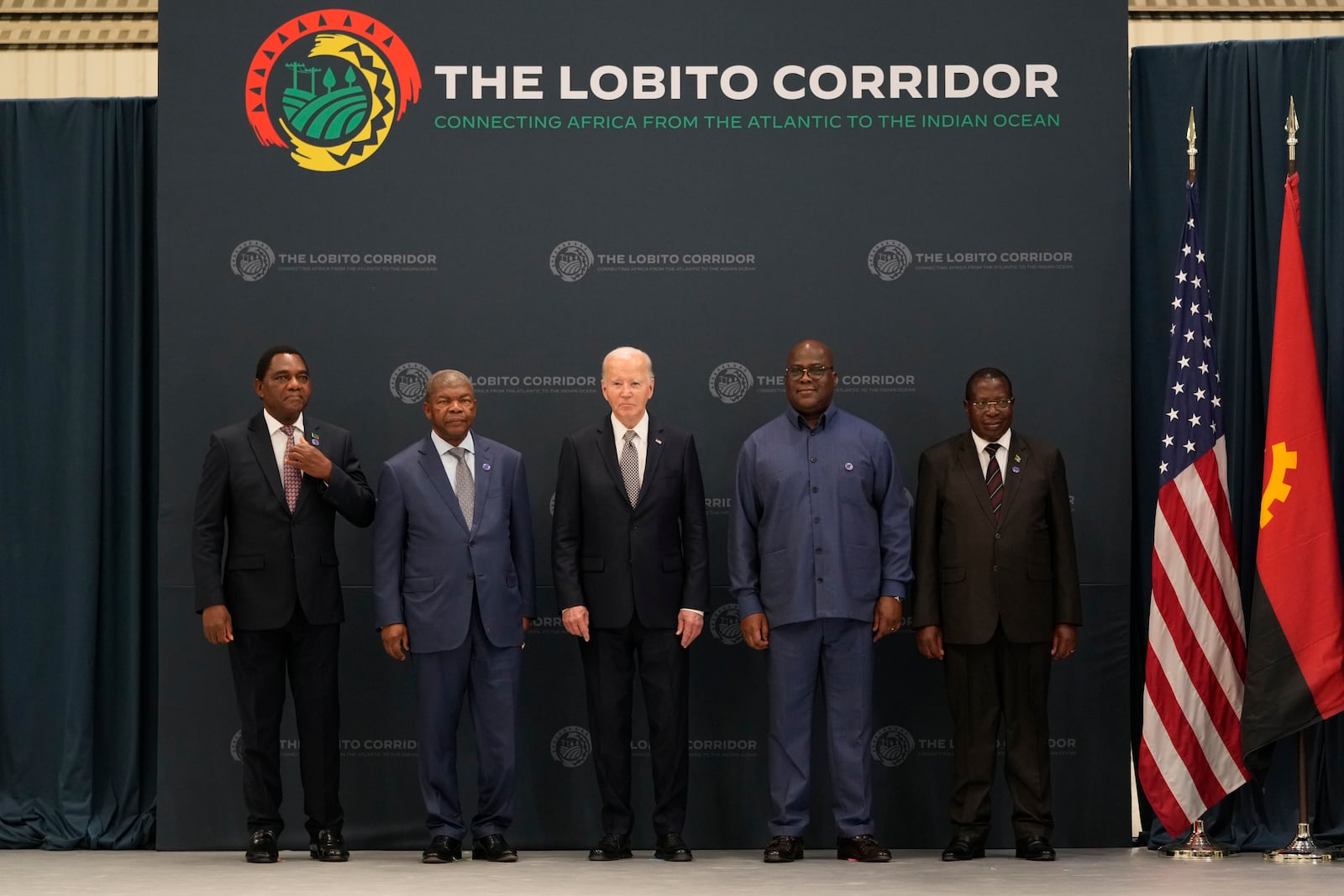 From the left, Zambia President Hakainde Hichilema, Angola's President Joao Lourenco, President Joe Biden, President Felix Tshisekedi of the Democratic Republic of the Congo, and Vice President of Tanzania Philip Isdor Mpango pose for a photo during the visit to the Carrinho food processing factory near Lobito, Angola on Wednesday, Dec. 4, 2024. (AP Photo/Ben Curtis)