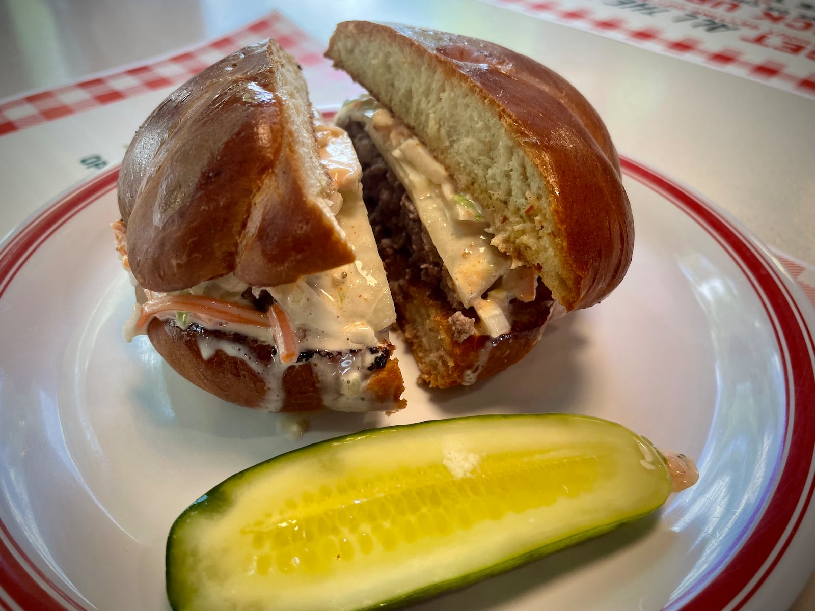 All The Best Delicatessen is now offering the Bestie Burger, a 6 oz. all beef burger topped with Swiss cheese, coleslaw and Russian dressing on a grilled challah knot. NATALIE JONES/STAFF