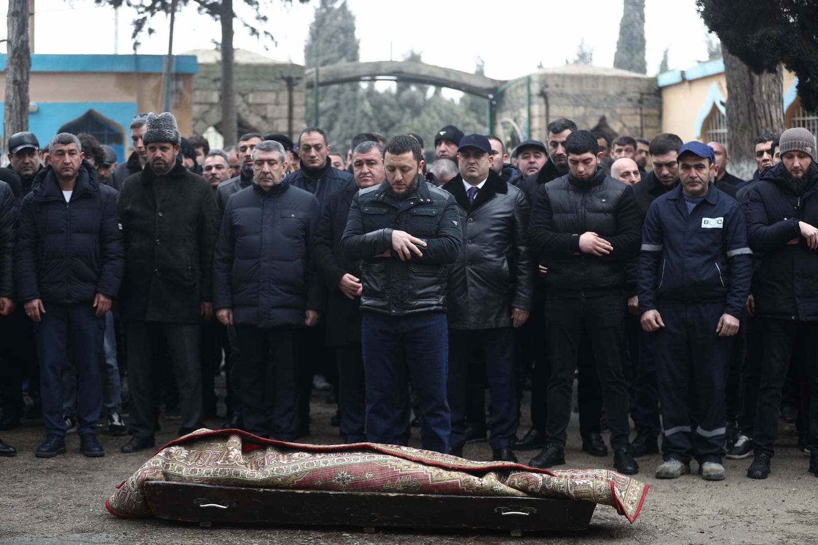 People attend a funeral of Mahammadali Eganov, 13 who died in the Azerbaijan Airlines Embraer 190 crash near Kazakhstan's Aktau airport, in Baku, Azerbaijan, Saturday, Dec. 28, 2024. (AP Photo)