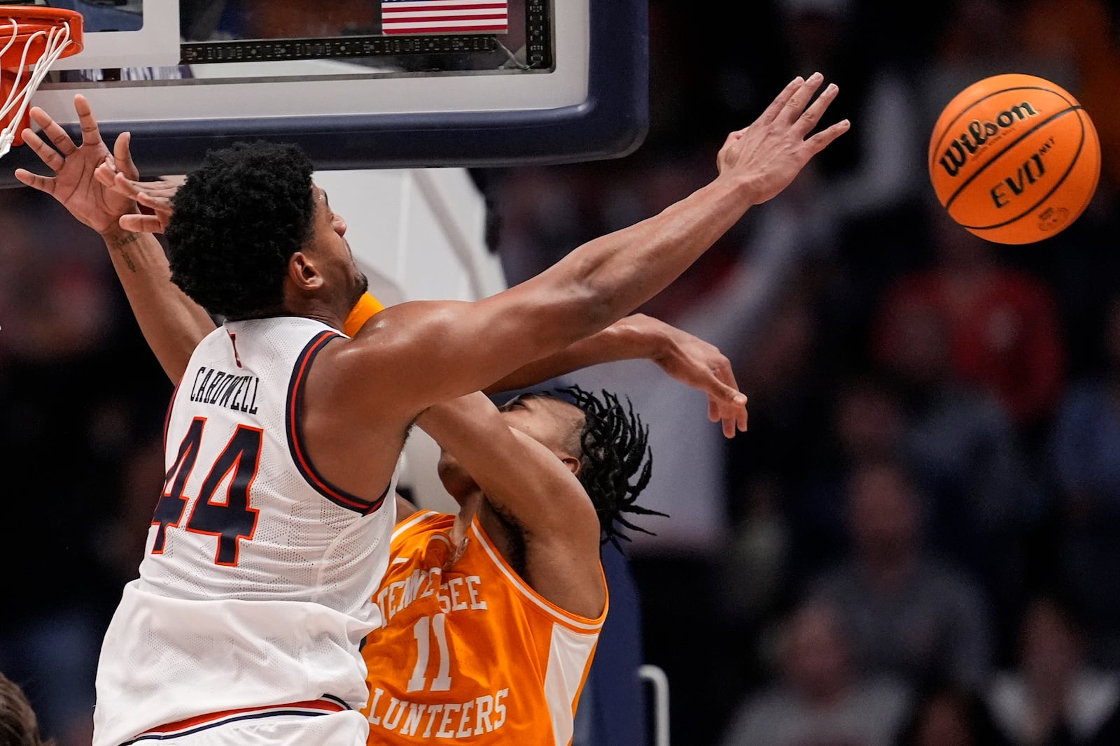 Auburn center Dylan Cardwell (44) collides with Tennessee guard Jordan Gainey (11) during the second half of an NCAA college basketball game in the semifinal round of the Southeastern Conference tournament, Saturday, March 15, 2025, in Nashville, Tenn. (AP Photo/George Walker IV)