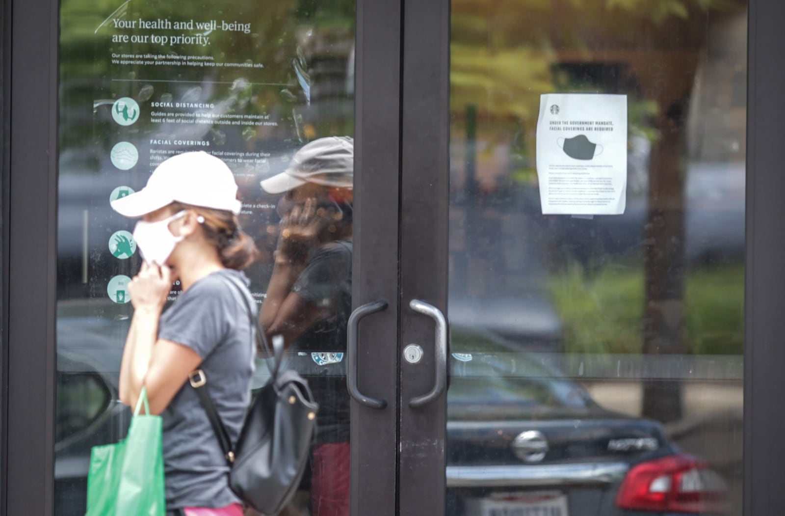 Many large retailers are now requiring that customers join their employees in wearing face masks to stop the spread of the coronavirus. Starbucks, Best Buy and Kroger have also announced mandatory masks nationwide in recent days. Starbucks and Best Buy started requiring that customers wear masks on July 15. Most people who entered the Starbucks on Far Hills Ave. in Oakwood were wearing masks. JIM NOELKER/STAFF