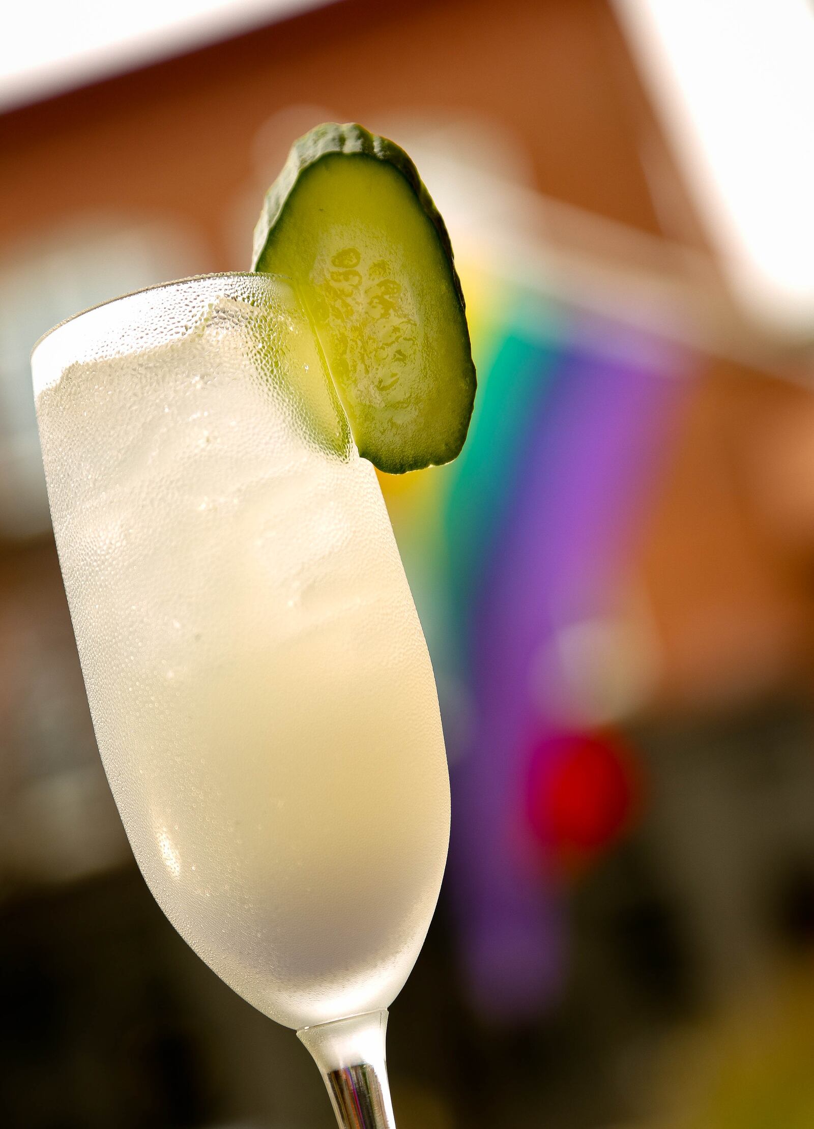 Wheat Penny Bar and Grill's summer cocktail "Autopilot," made with Hendricks Gin, House-Made Cucumber Mint Basil Syrup, Creme De Violette, Fresh Squeezed Lemon Juice and a Cucumber Garnish. JIM WITMER/STAFF