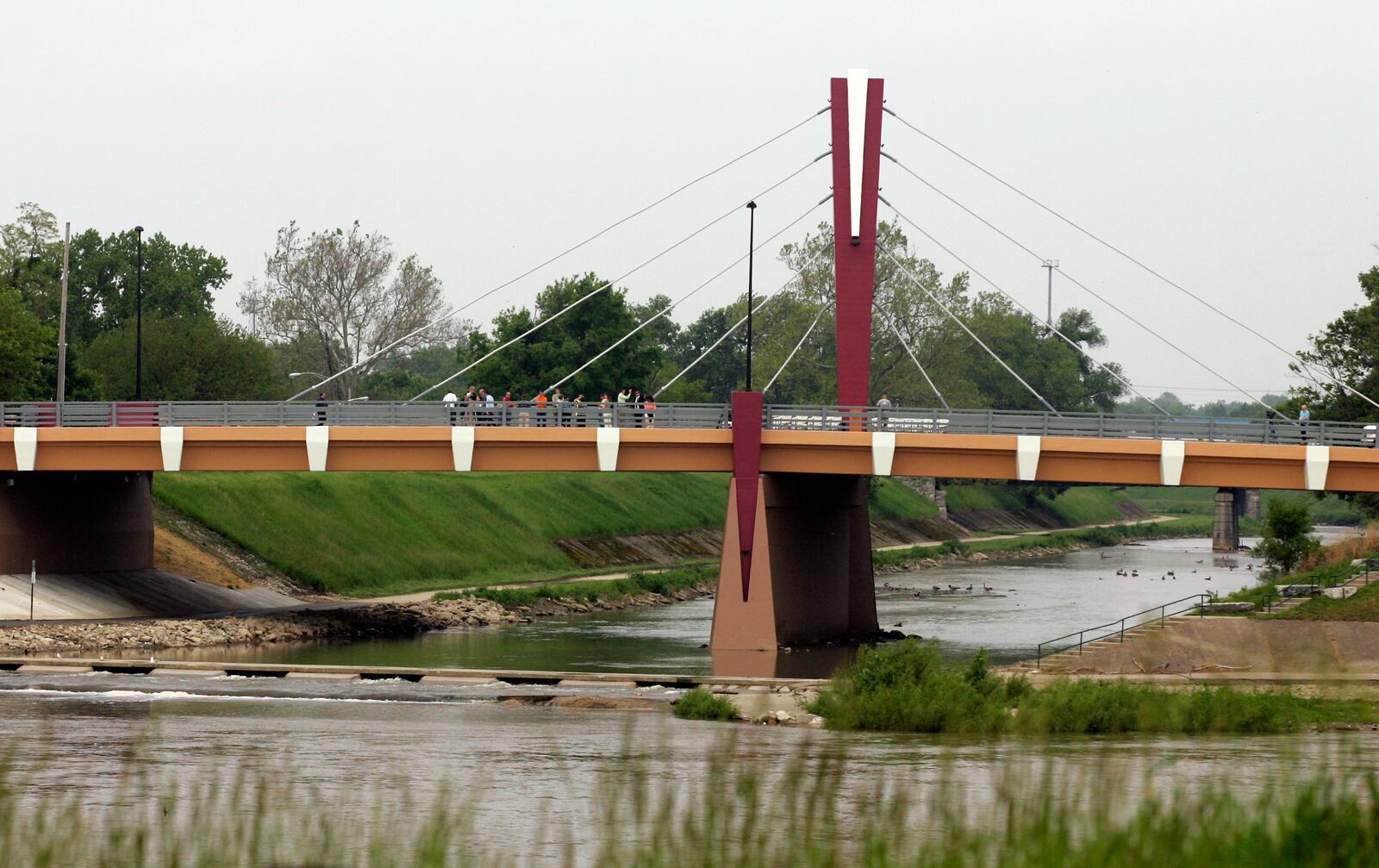 The city of Dayton dedicated the newly constructed Edwin C. Moses Boulevard Bridge in May 2010. The $4.53 million concrete girder bridge has been under construction since February of 2009. The new bridge, which was designed by RW Armstrong and built by the Eagle Bridge Company, will provide a path over the Wolf Creek. It features an ornamental, neo-classic cable-stayed design with a V-shaped central tower and cables illuminated by LED technology. Staff photo by Jim Witmer