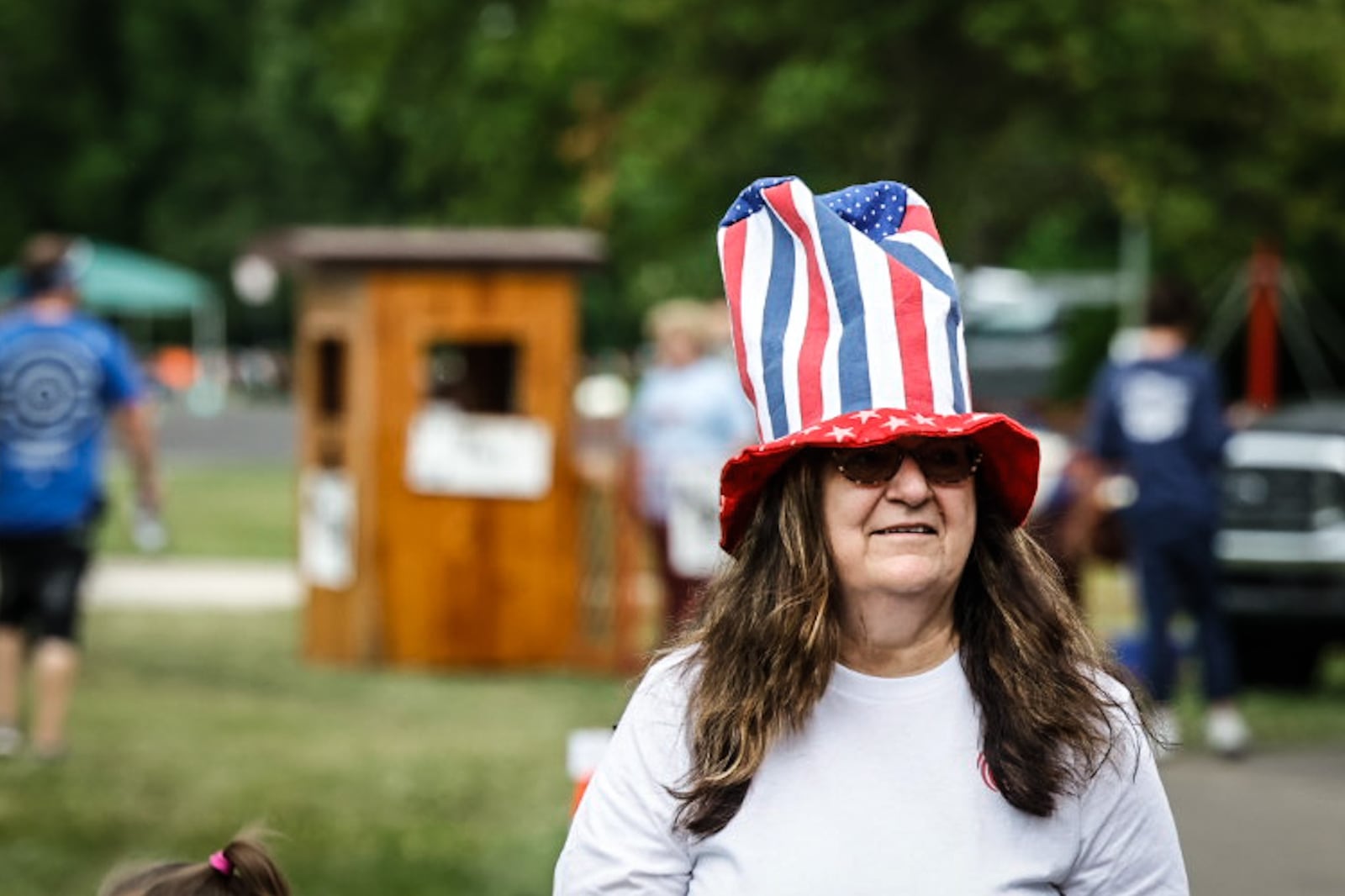 Peggy Miller of Englewood walks around Community Park in Fairborn on Monday at the July 3rd block party. At 10 a.m. on the Fourth of July, there will be a parade from Central Avenue to Main Street. JIM NOELKER/STAFF