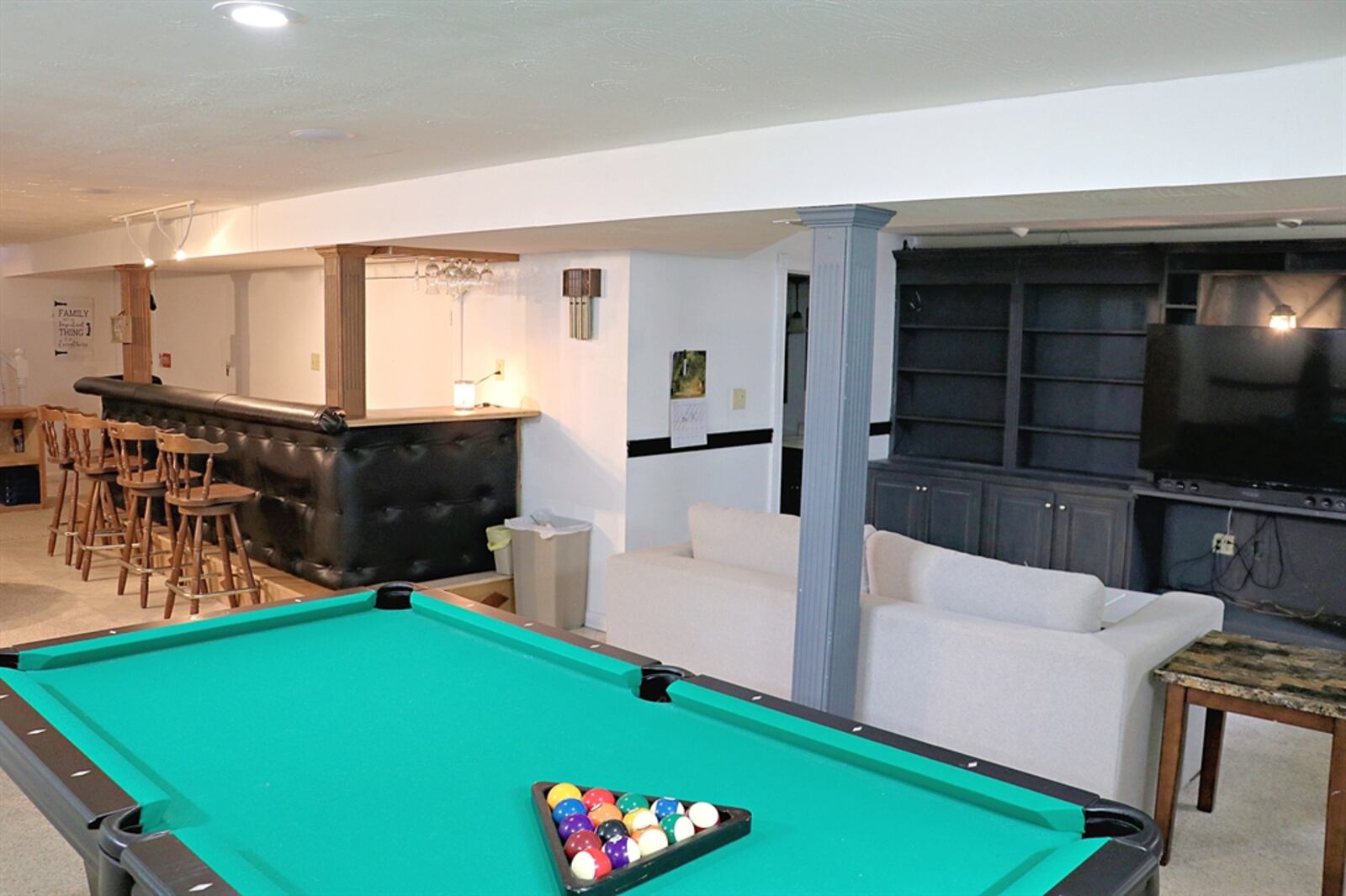 The basement features a recreation room, media room, bar and family room.