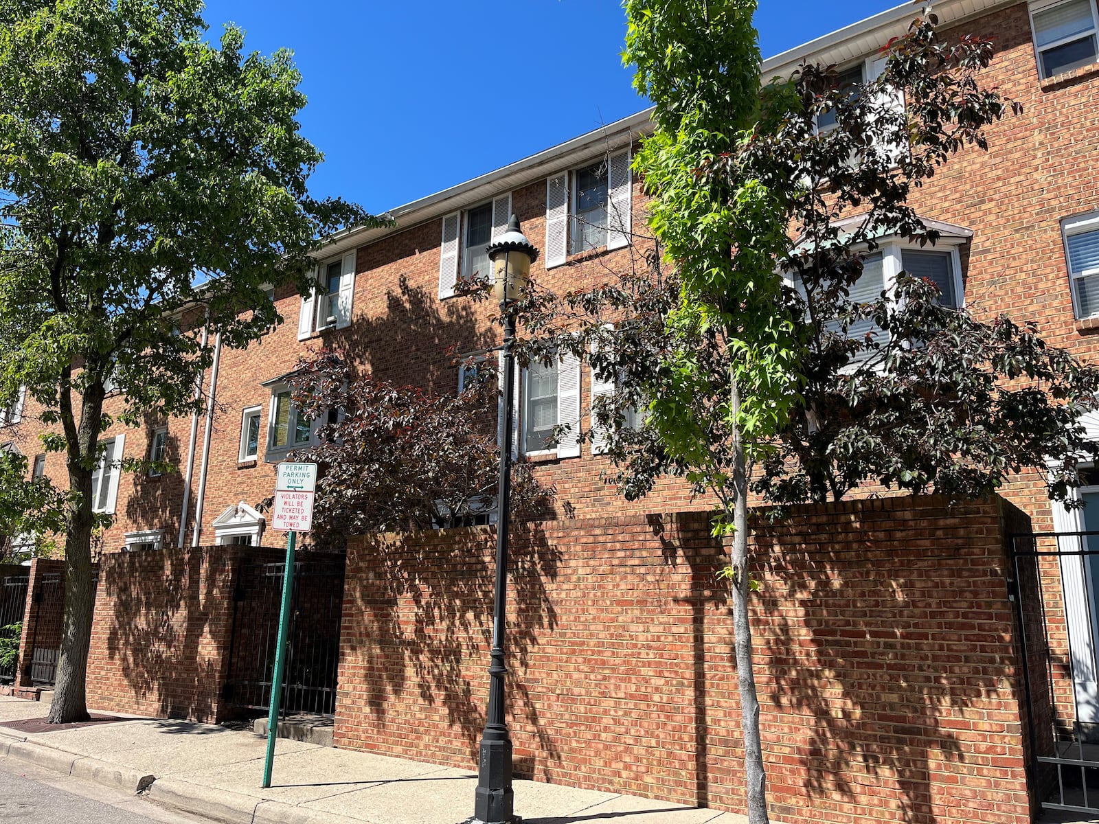 Cooper Place is 34 brick townhomes located north of East Second Street in downtown Dayton. The housing is just north of Cooper Park, which is where some grassroots and faith-based organizations have handed out food to homeless individuals. CORNELIUS FROLIK / STAFF