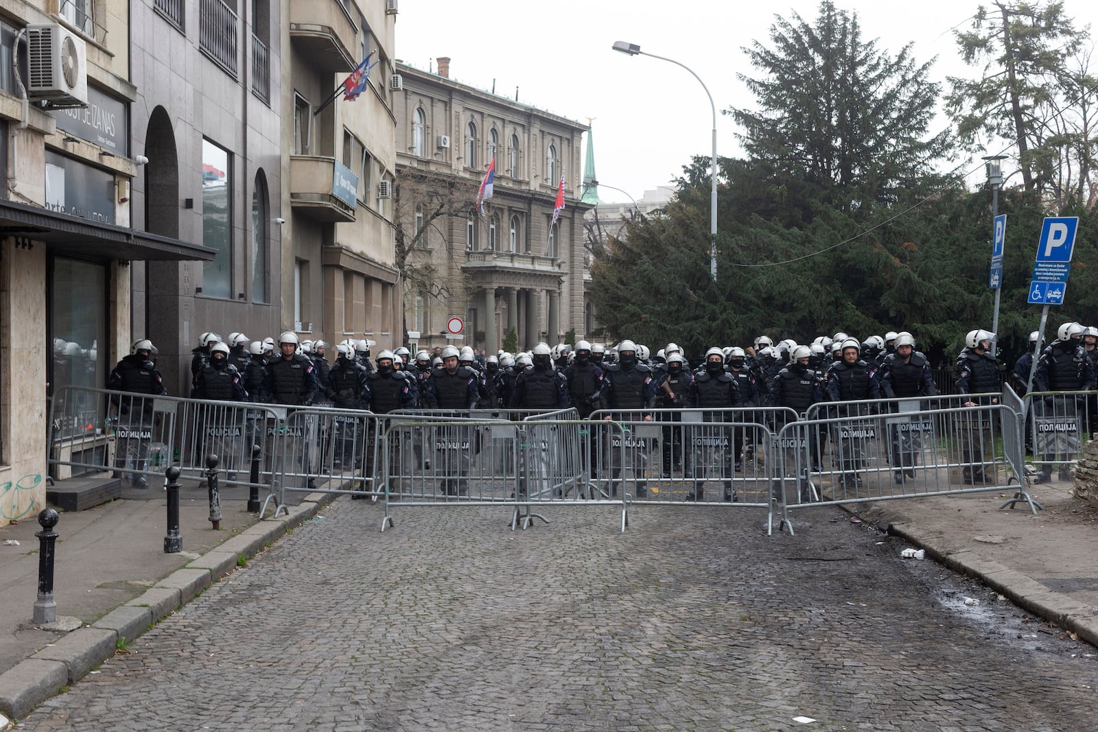 Police in riot gear cordon off a street in front of the office of the president of Serbia during a major anti-corruption rally led by university students in Belgrade, Serbia, Saturday, March 15, 2025. (AP Photo/Marko Drobnjakovic)