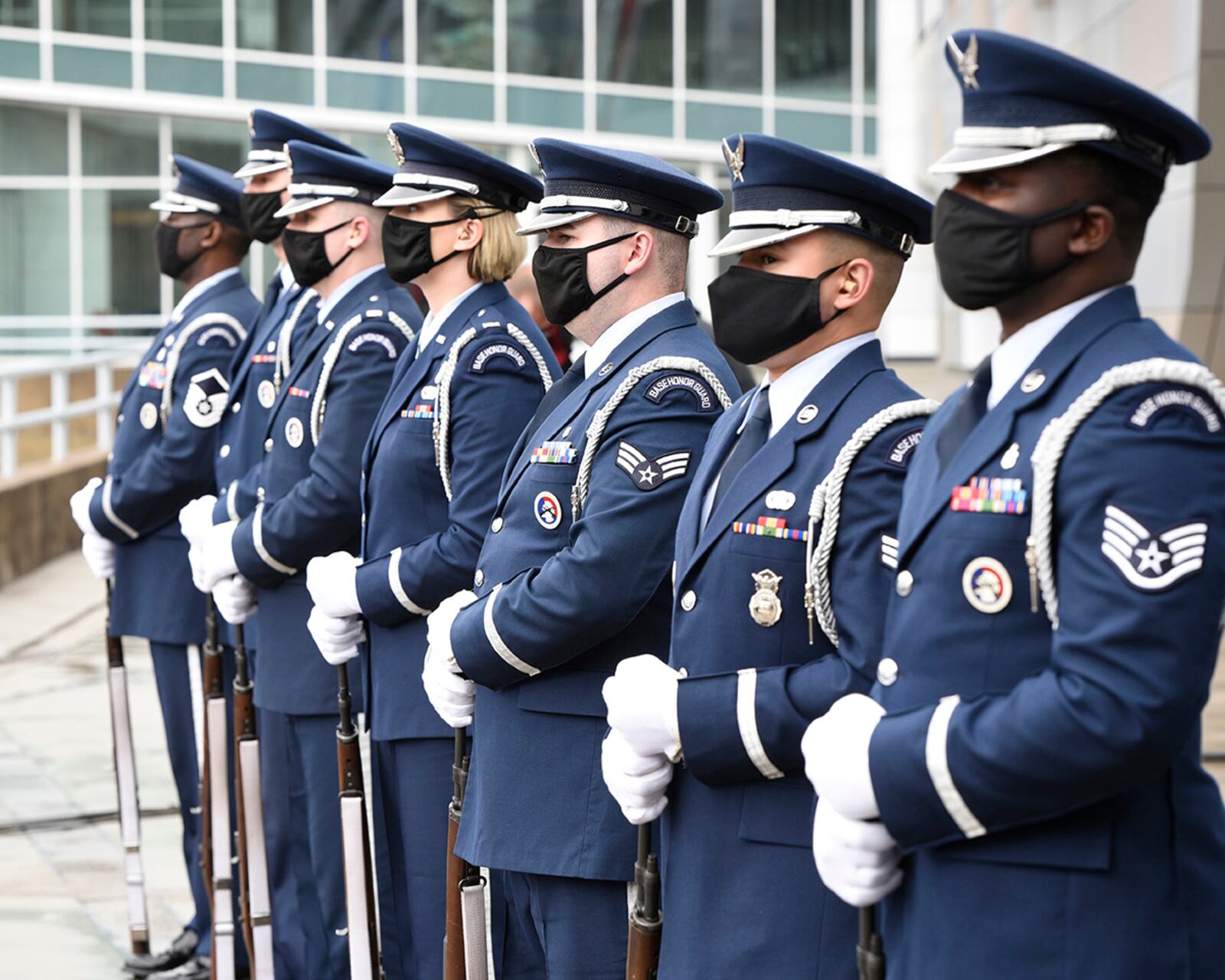 Honor Guard members from Wright-Patterson Air Force Base prepare to perform a 21-gun salute during the “Celebration of Life” service for retired Brig. Gen. Chuck Yeager at the Charleston Coliseum & Convention Center in West Virginia on Jan. 15, 2021. The WPAFB unit logged 1,008,120 miles in ceremonial support last year. U.S. AIR FORCE PHOTO/TY GREENLEES