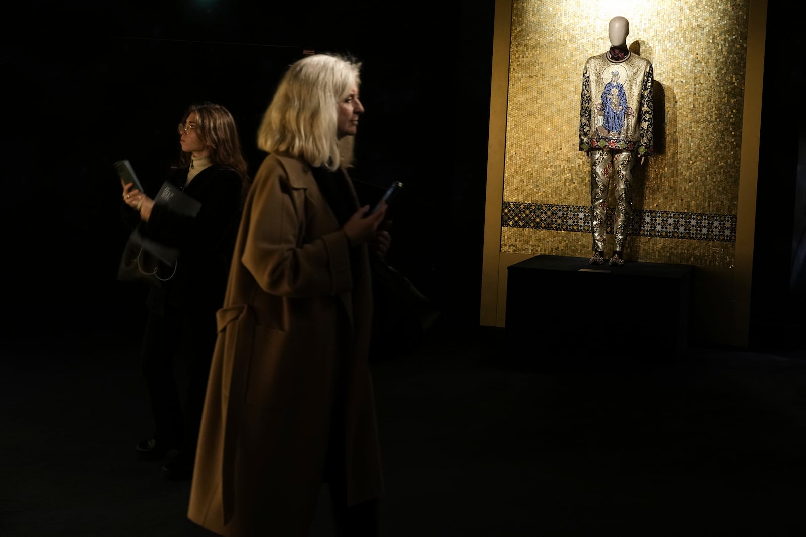 Creations are displayed during the exhibition "From the Heart to the Hands: Dolce&Gabbana" at the Grand Palais, in Paris, Thursday, Jan. 9, 2025. (AP Photo/Thibault Camus)