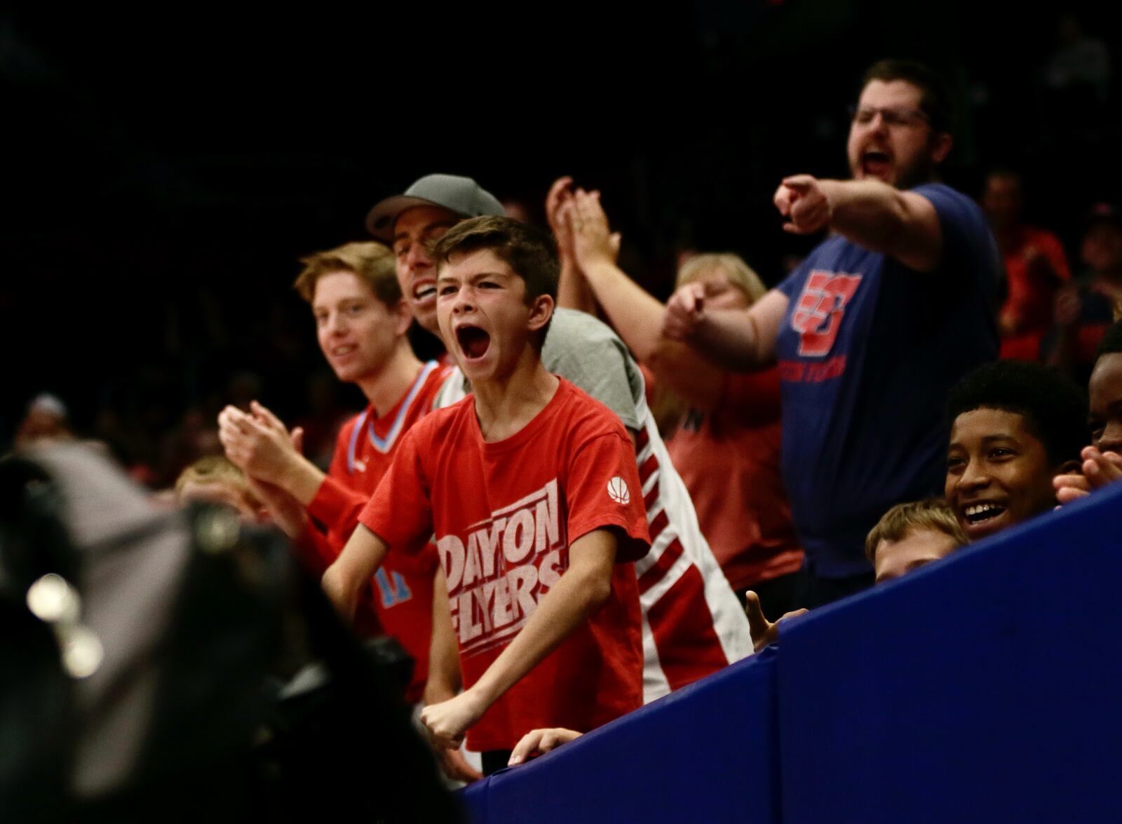 Fans cheer during a game between the Red Scare and The Money Team on Wednesday, July 27, in the third round of The Basketball Tournament at UD Arena in Dayton. David Jablonski/Staff