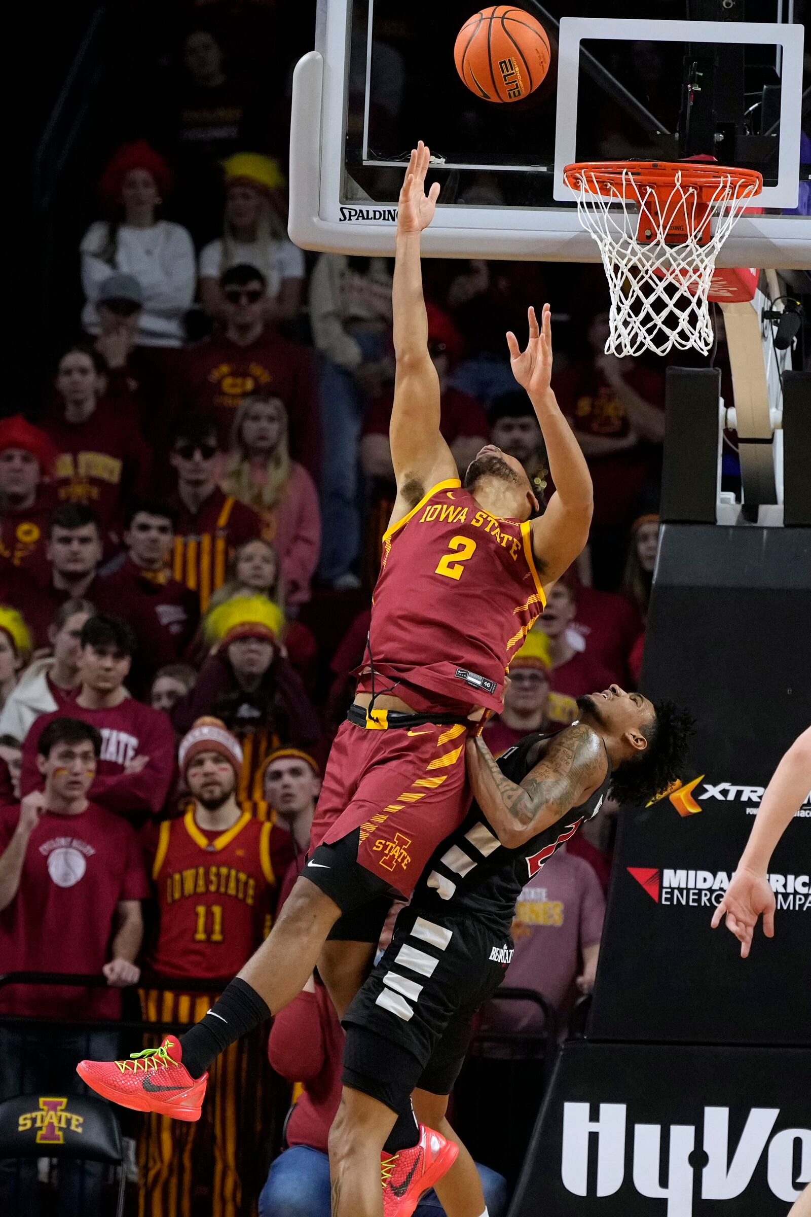 Iowa State forward Joshua Jefferson (2) shoots over Cincinnati forward Dillon Mitchell during the first half of an NCAA college basketball game Saturday, Feb. 15, 2025, in Ames, Iowa. (AP Photo/Charlie Neibergall)