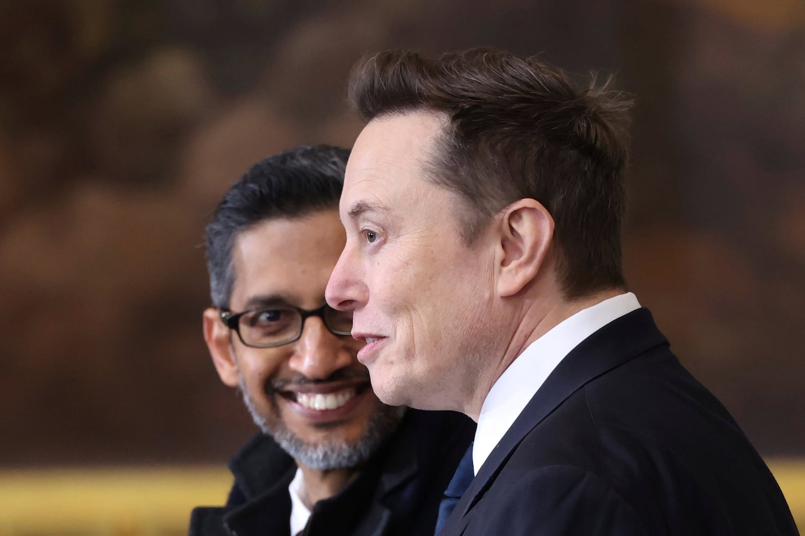 Google CEO Sundar Pichai, left, and Tesla and SpaceX CEO Elon Musk arrive before the 60th Presidential Inauguration in the Rotunda of the U.S. Capitol in Washington, Monday, Jan. 20, 2025. (Kevin Lamarque/Pool Photo via AP)