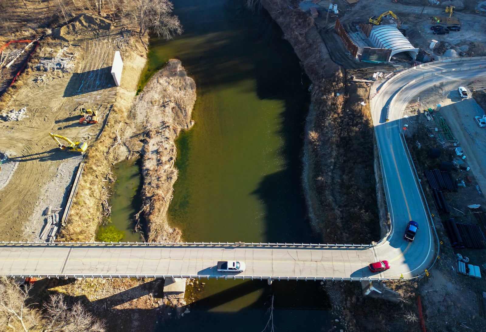 The King Ave. bridge project over Little Miami River on the Hamilton Twp. / Deerfield Twp. line began in March 2022 and should be complete in December 2023. The two-span bridge will carry two lanes plus a multi-use path, span the river without any piers in the riverbed, cross over the Little Miami Multi-Use Path and carry water and sewer utilities. The project will add a new parking area along the Little Miami Path and access the Cartridge Factory development on the Grandin Road side with a roundabout. NICK GRAHAM/STAFF