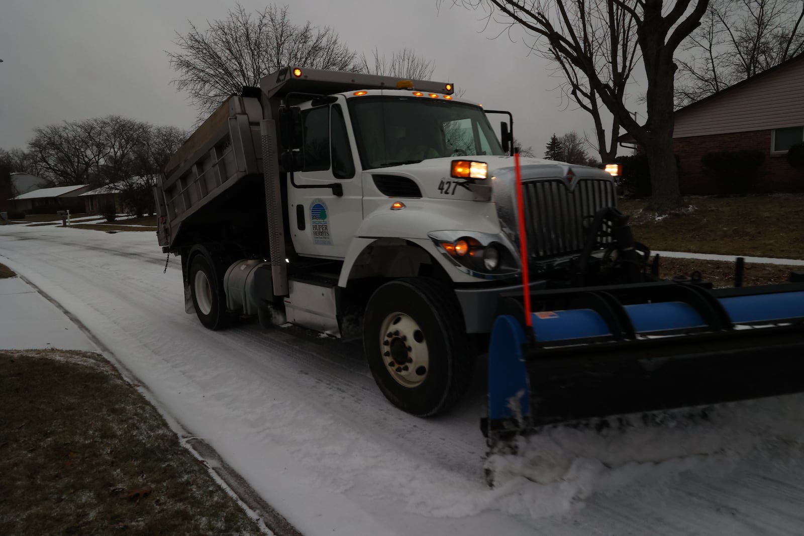 A City of Huber Heights plow truck cleans off Dial Drive the morning of Thursday, Feb. 3, 2022. BILL LACKEY/STAFF