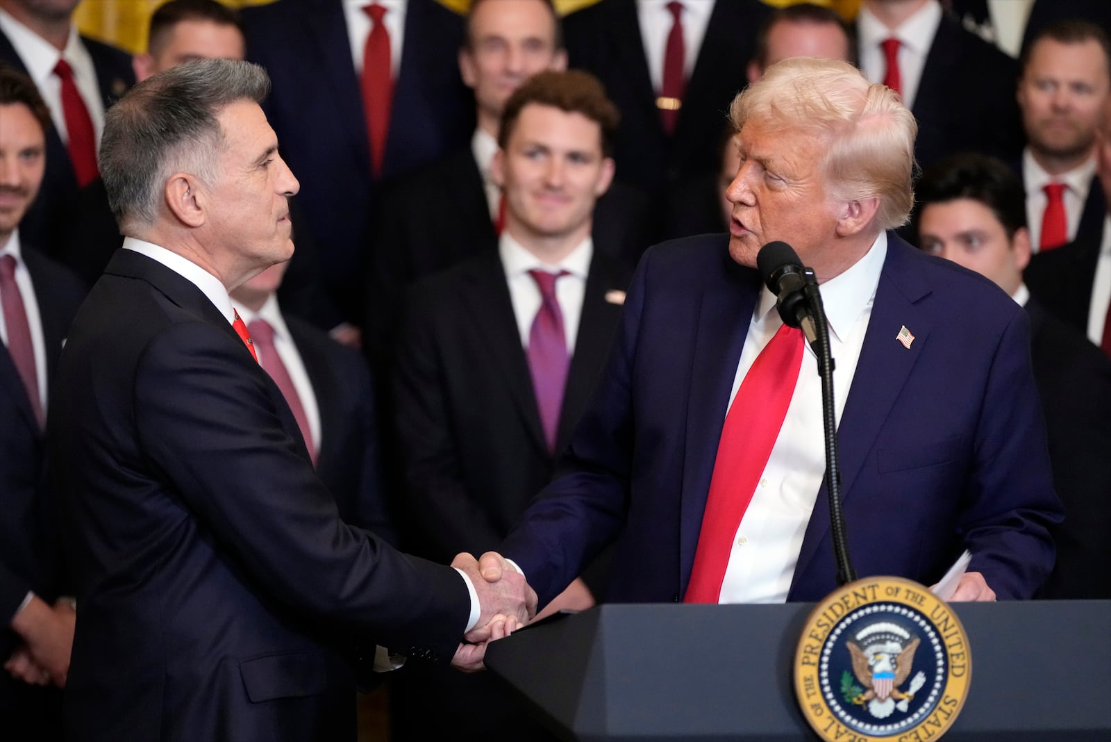 President Donald Trump shakes hands with team owner Vincent Viola during a ceremony with the Florida Panthers NHL hockey team to celebrate their 2024 Stanley Cup victory in the East Room of the the White House, Monday, Feb. 3, 2025, in Washington. (AP Photo/Alex Brandon)