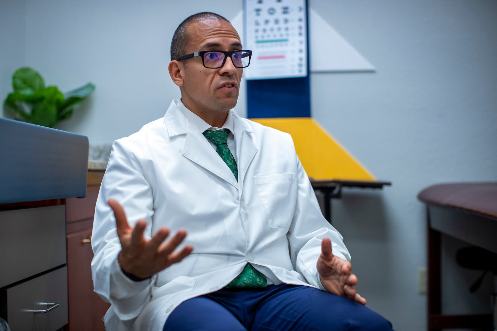 Pediatric endocrinologist Dr. Hector Granados speaks during an interview at his private practice in El Paso, Texas, Tuesday, Jan. 21, 2025. (AP Photo/Andres Leighton)