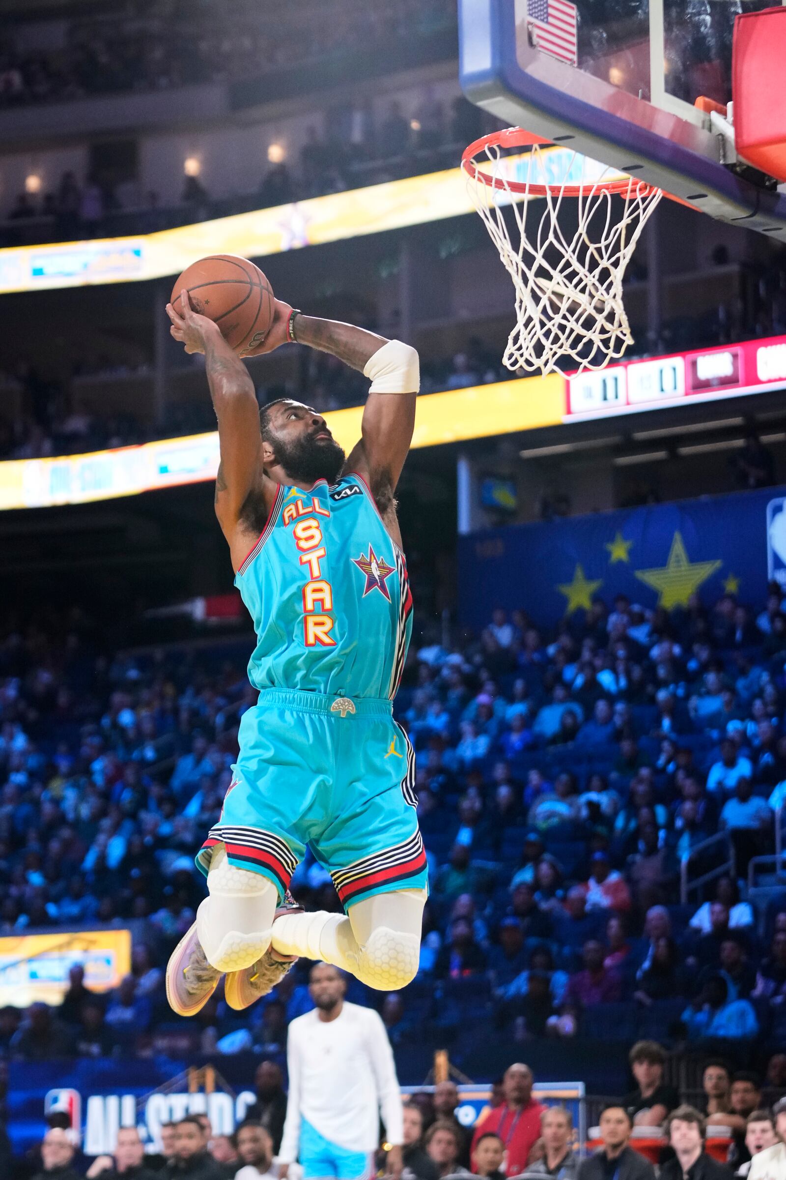 Dallas Mavericks guard Kyrie Irving scores on a fast break dunk during the NBA All-Star basketball game Sunday, Feb. 16, 2025, in San Francisco. (AP Photo/Godofredo A. Vásquez)