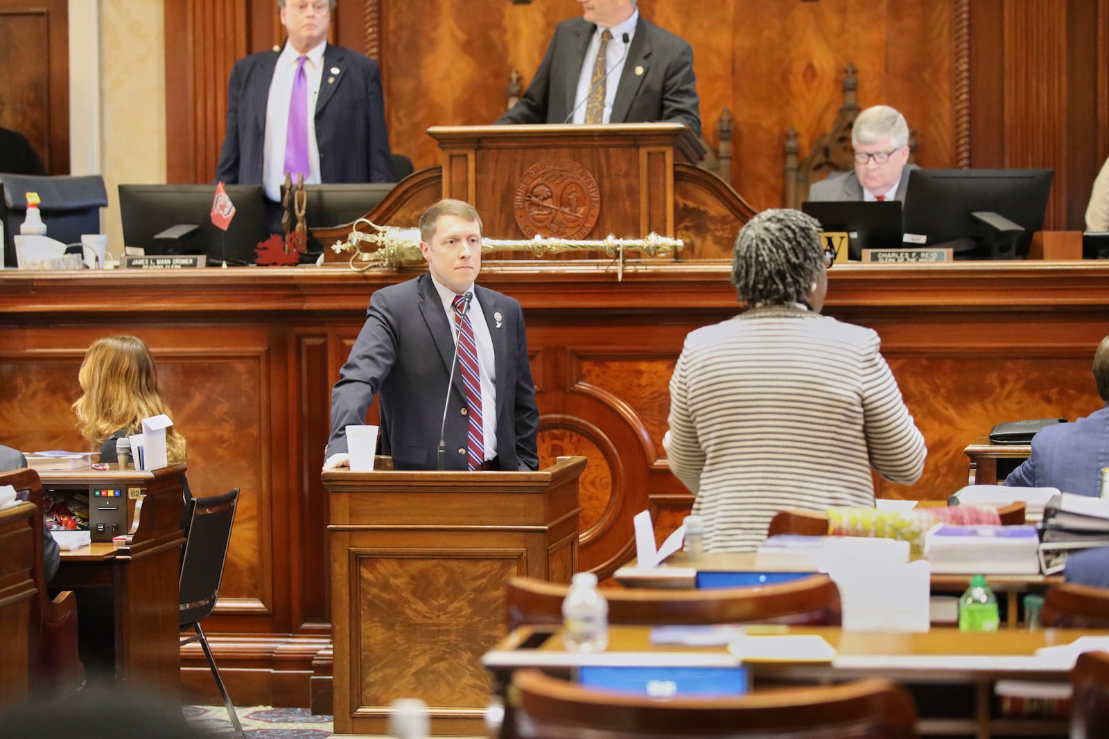 South Carolina Rep. Jordan Pace, R-Goose Creek, left, listens to a question from Rep. Gilda Cobb-Hunter, D-Orangeburg, right, during the House budget debate on Tuesday, March 11, 2025, in Columbia, S.C. (AP Photo/Jeffrey Collins)