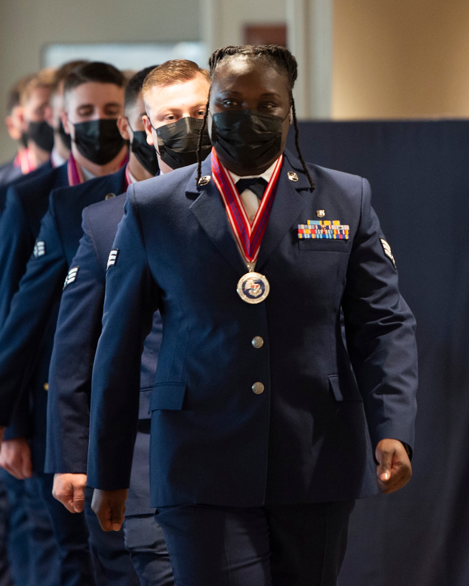 Senior Airman Shaquel Johnson leads Airman Leadership School Class 22-F into its graduation ceremony Aug. 18 at the Wright-Patterson Club. ALS is required for staff sergeant selects and open to eligible civilians as Airmen learn more about leadership and Air Force culture. U.S. AIR FORCE PHOTO/JAIMA FOGG