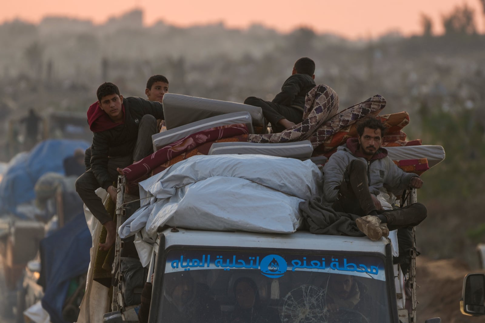 Displaced Palestinians make their way from central Gaza to their homes in the northern Gaza Strip, Monday, Feb. 10, 2025. (AP Photo/Abdel Kareem Hana)