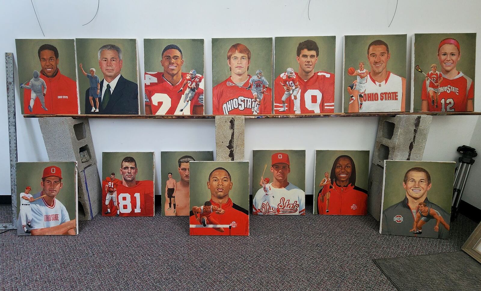 Former Ohio State University football player, Greg Storer, creates paintings for inductees into The Ohio University Athletics Hall of Fame in his art studio and teaching facility in Mason. The paintings are gifted to the inductees by the University at the induction ceremony. NICK GRAHAM/STAFF